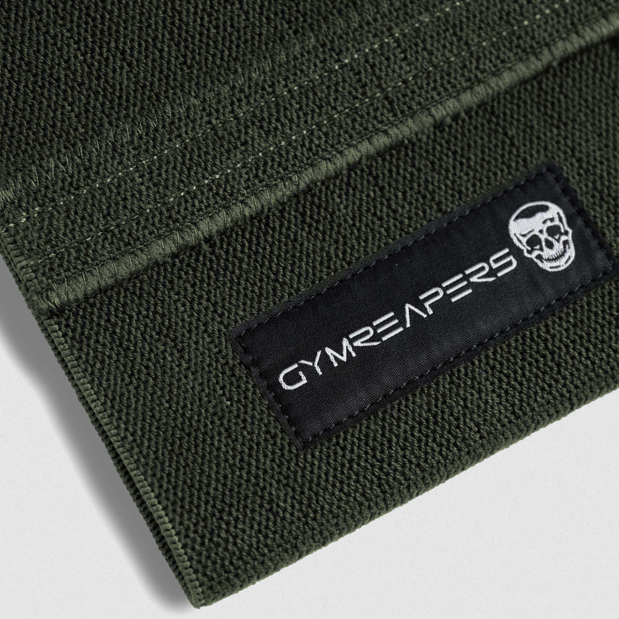 close up detail shot of elbow compression cuff logo