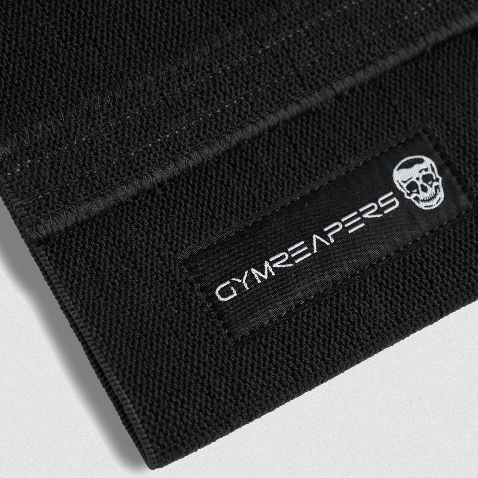 close up detail shot of logo on the elbow compression cuffs