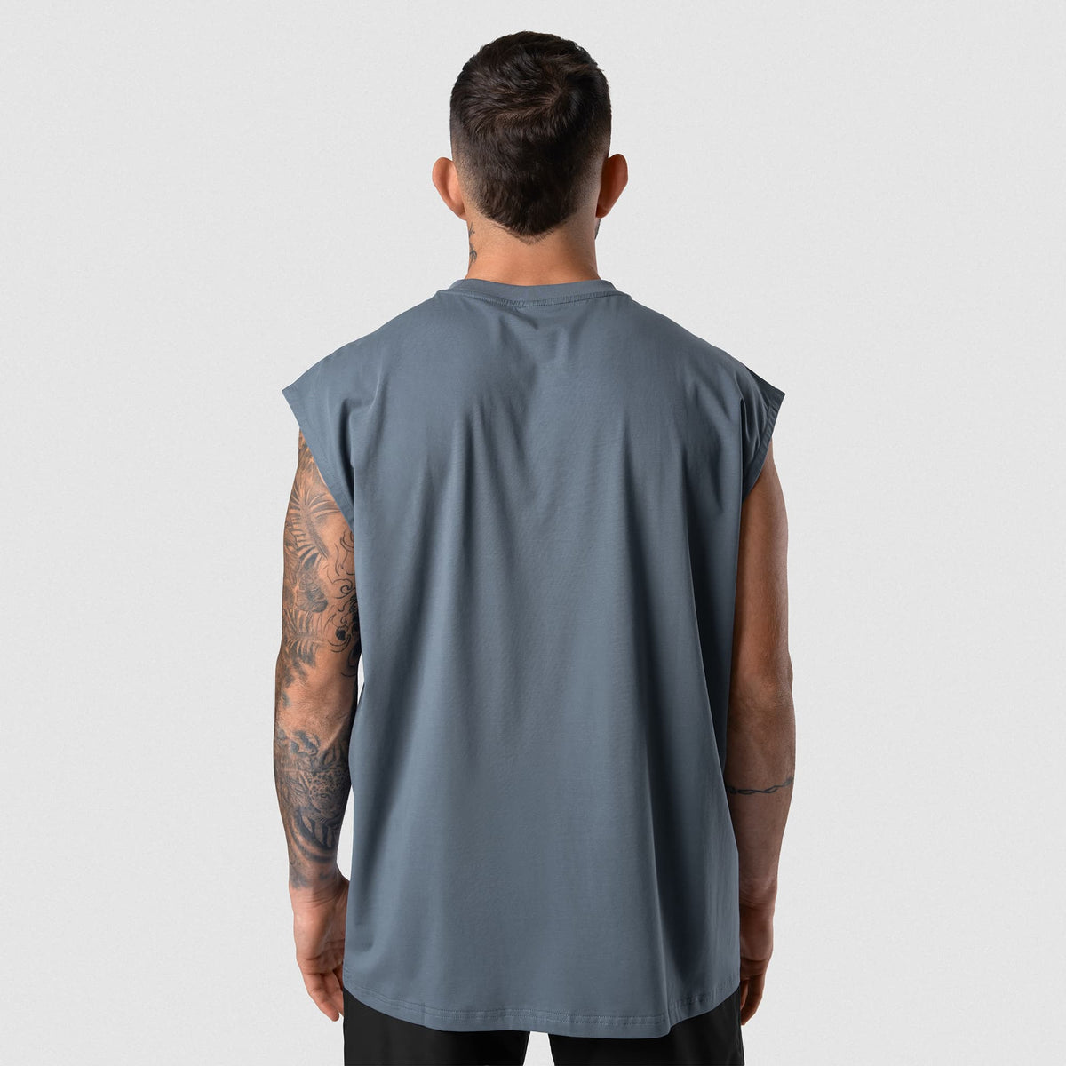 Man wearing Axis Cap Sleeve Tank - Lake back fit