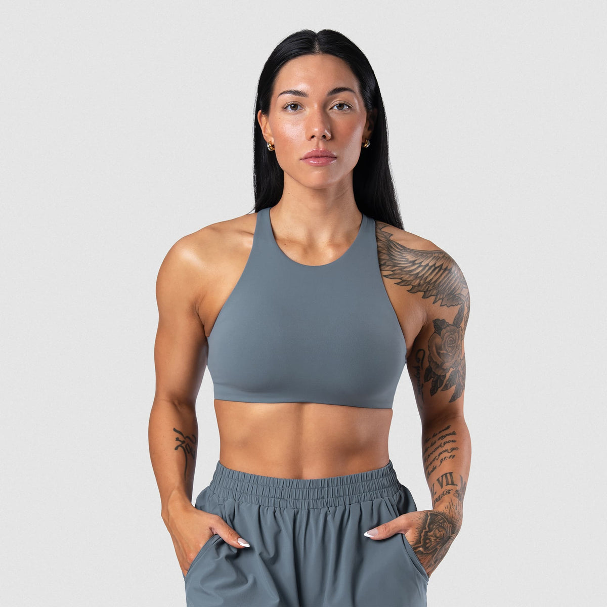 Female model wearing the Axis High Neck Bra - Lake front view