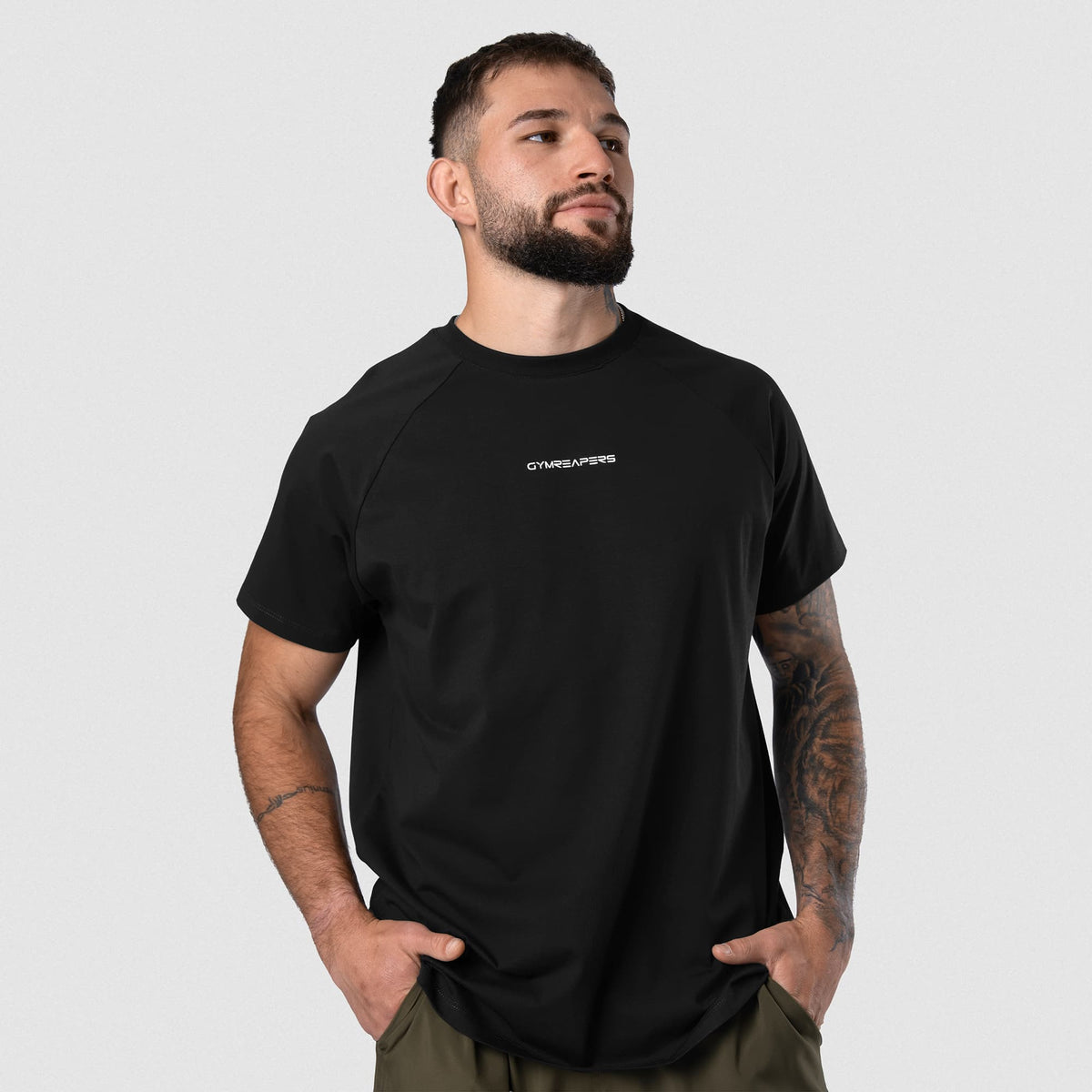 Male model wearing the Axis Raglan Tee - Black/White front view