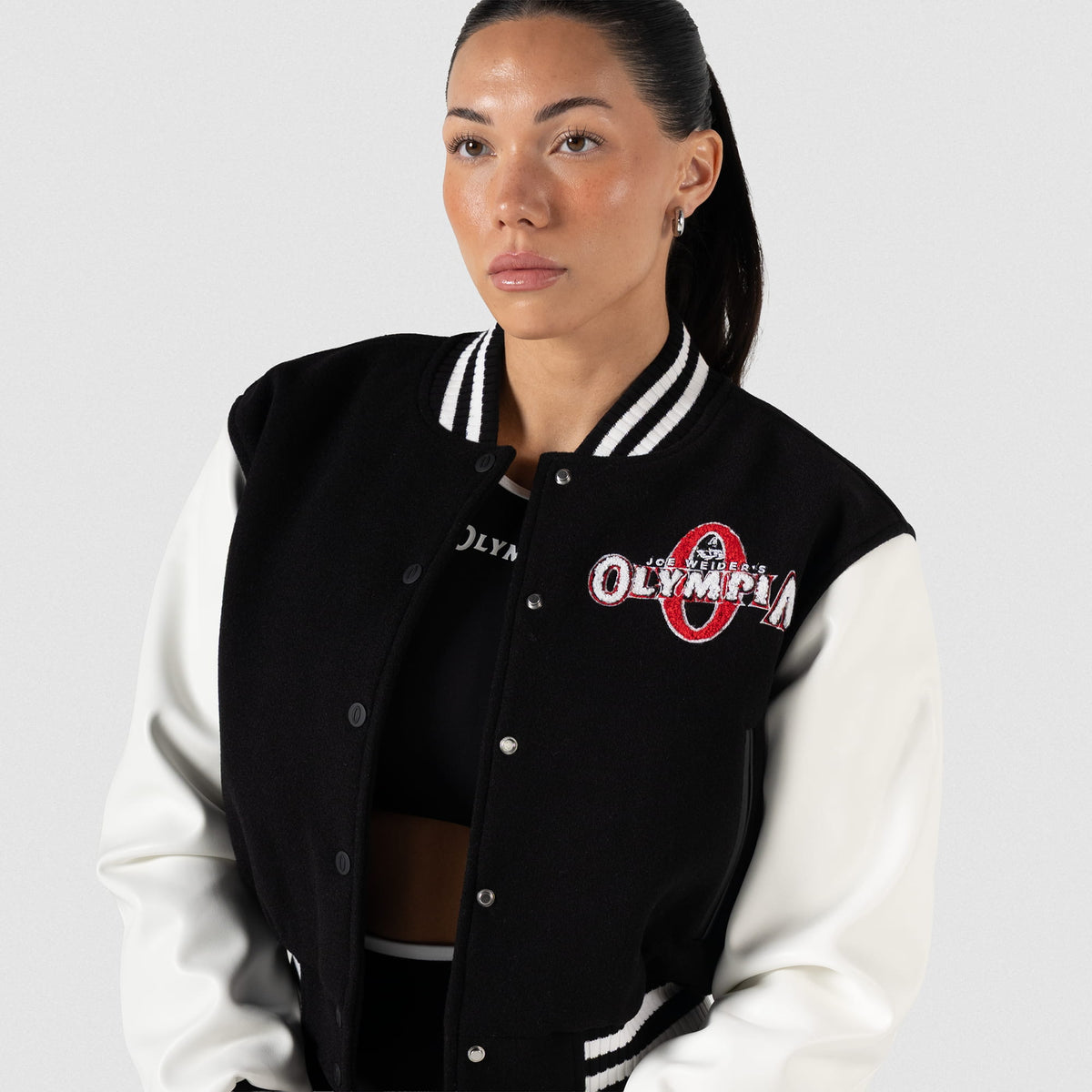 Signature Crop Varsity Jacket | Front view of model, jacket unbuttoned