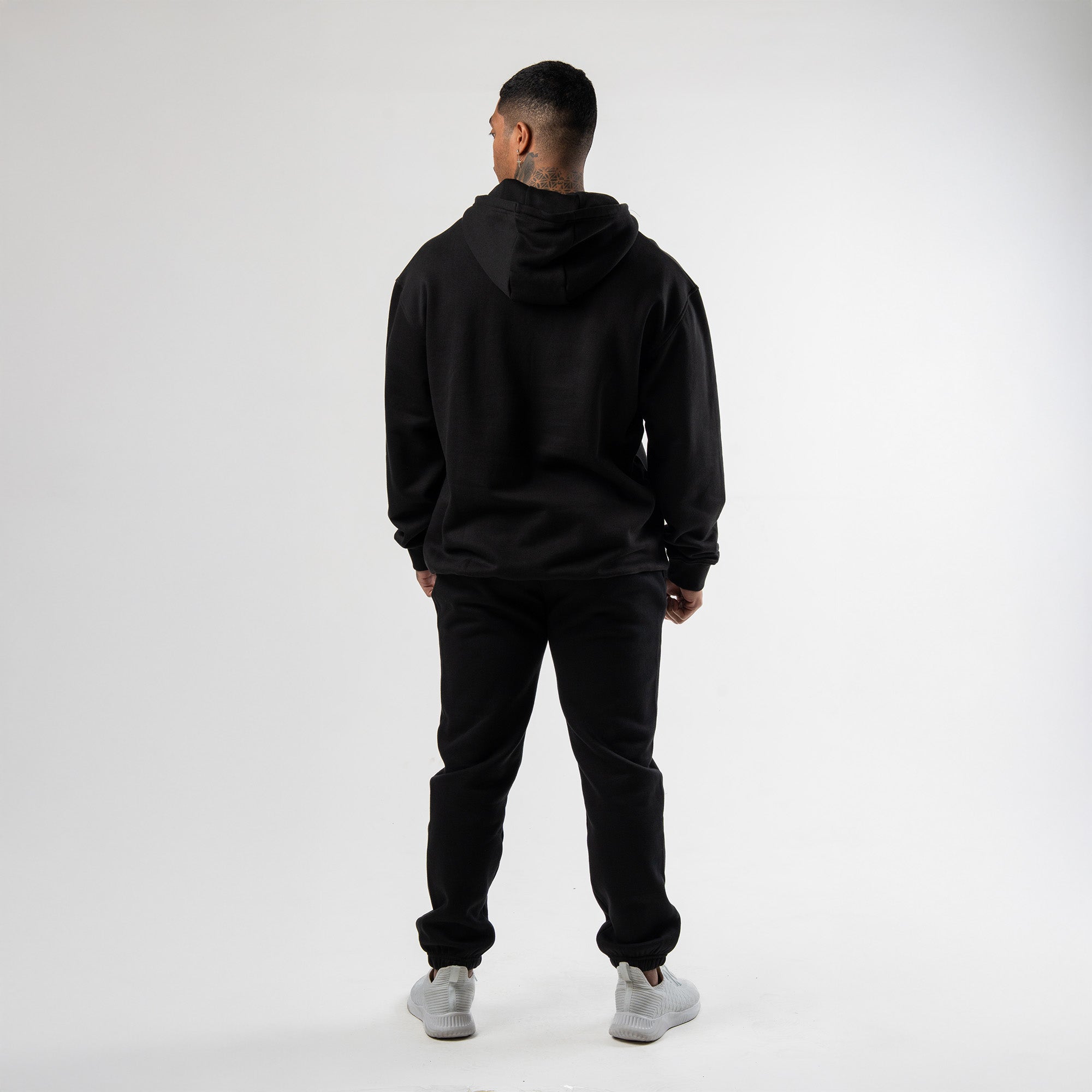 athlete wearing axis mockneck hoodie full body shot back view
