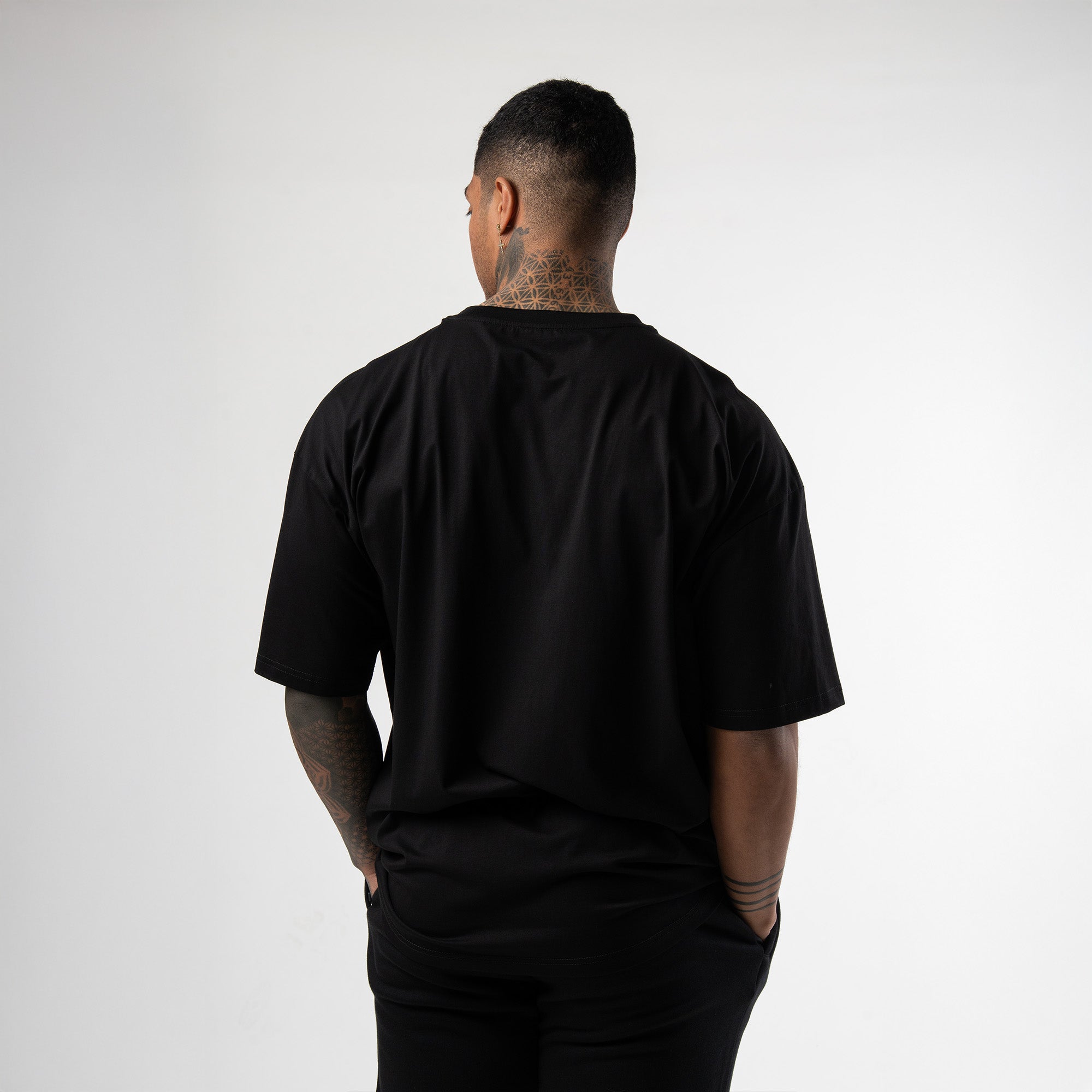 athlete wearing black axis box tee back view