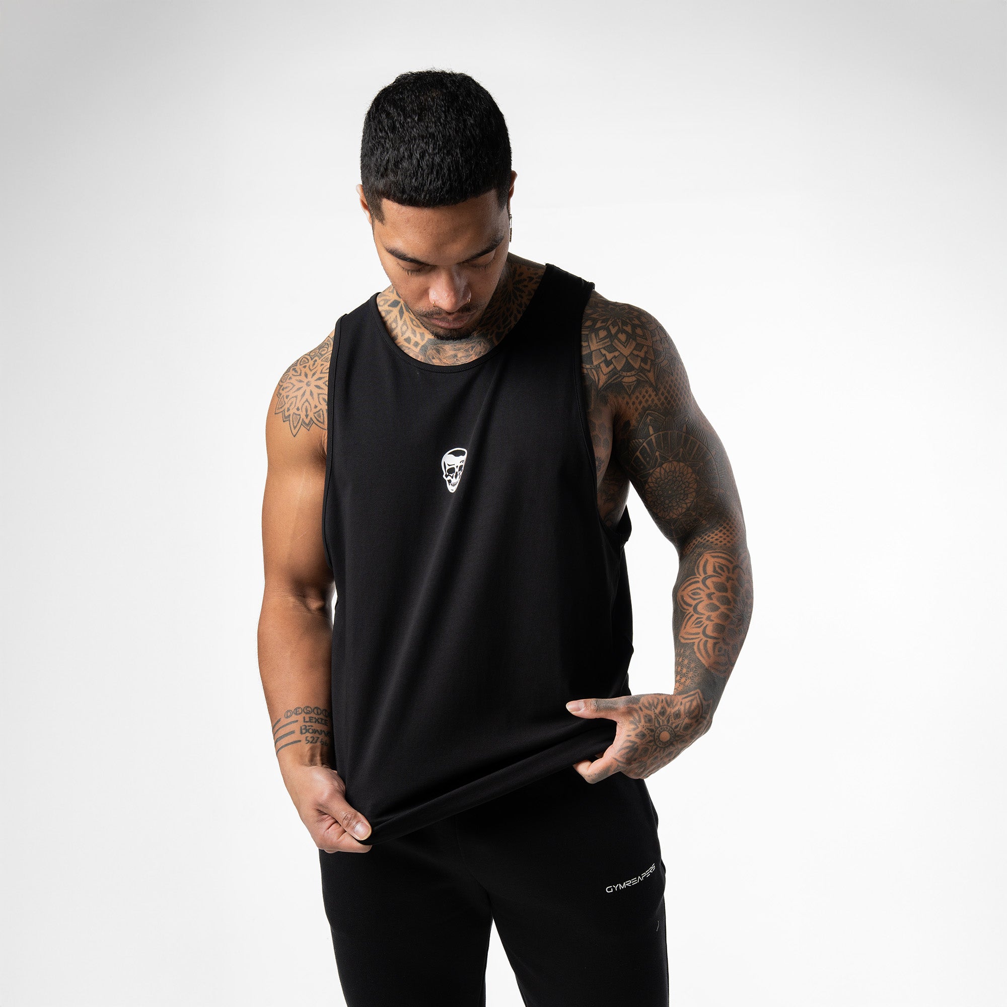 athlete wearing the black/white axis scoop hem tank front view