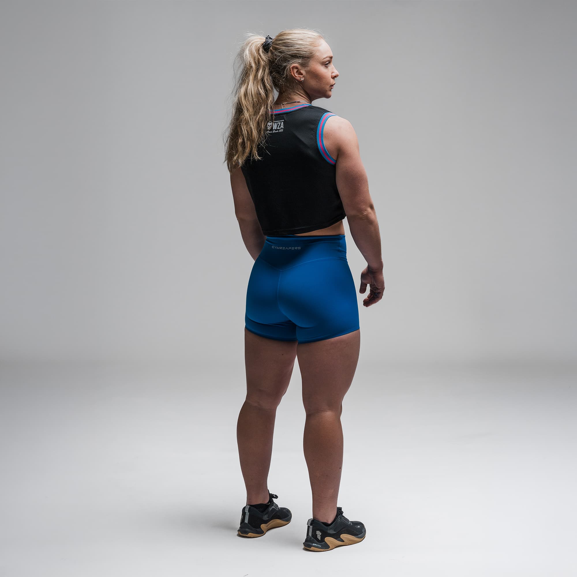 Athlete wearing the Miami Beach Cropped Jersey full body shot back view