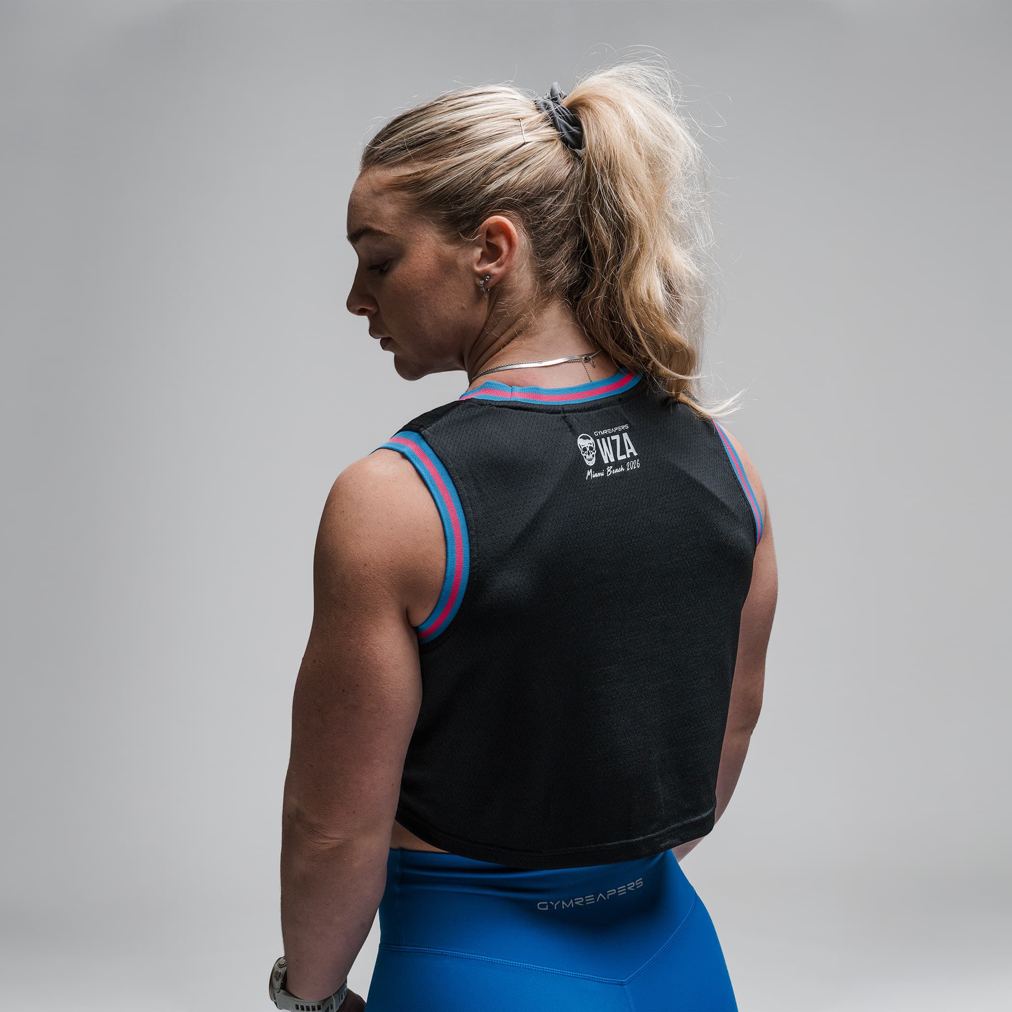 Athlete wearing the Miami Beach Cropped Jersey half body shot back view