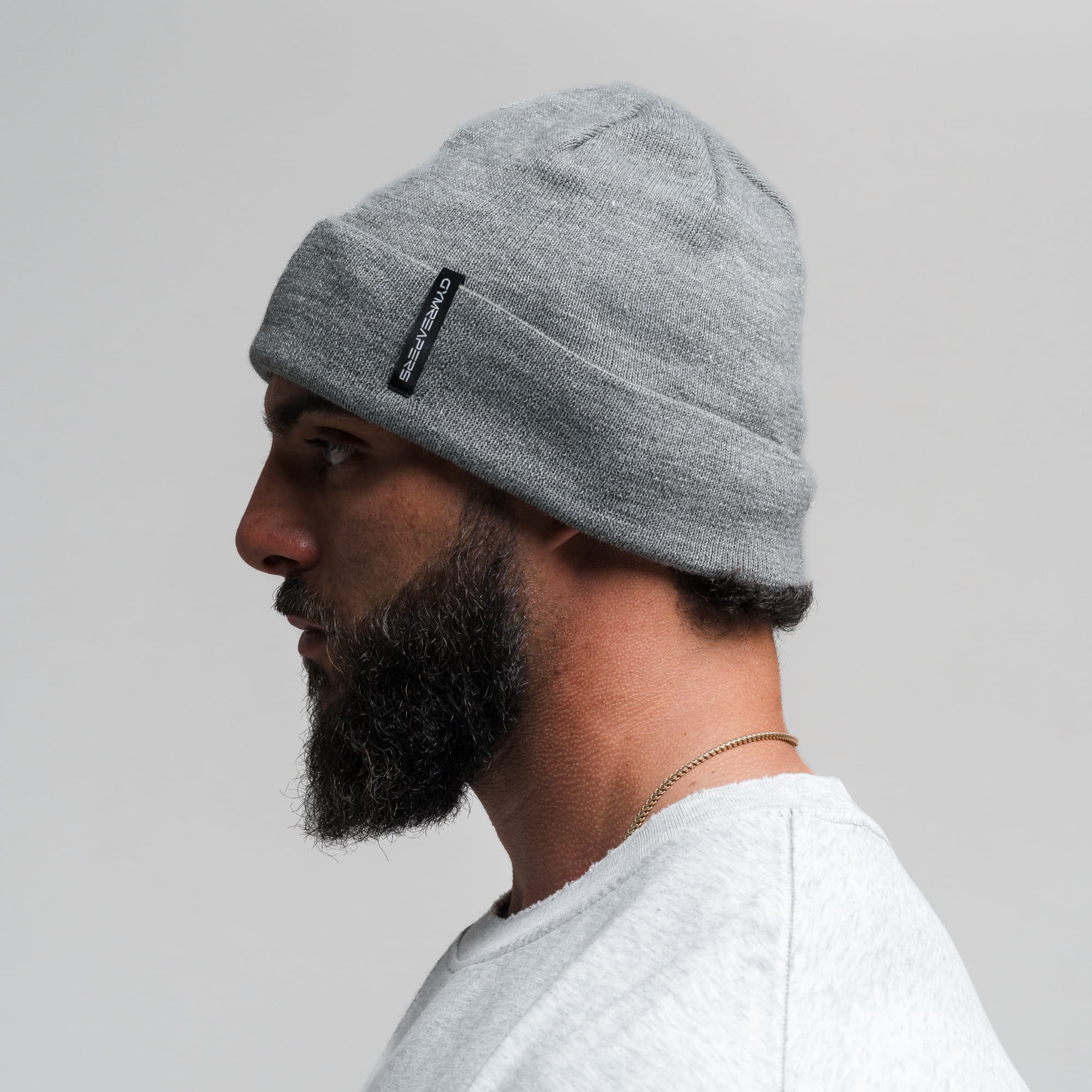 Athlete wearing Core Knit Cuff Beanie - Dark Gray side view