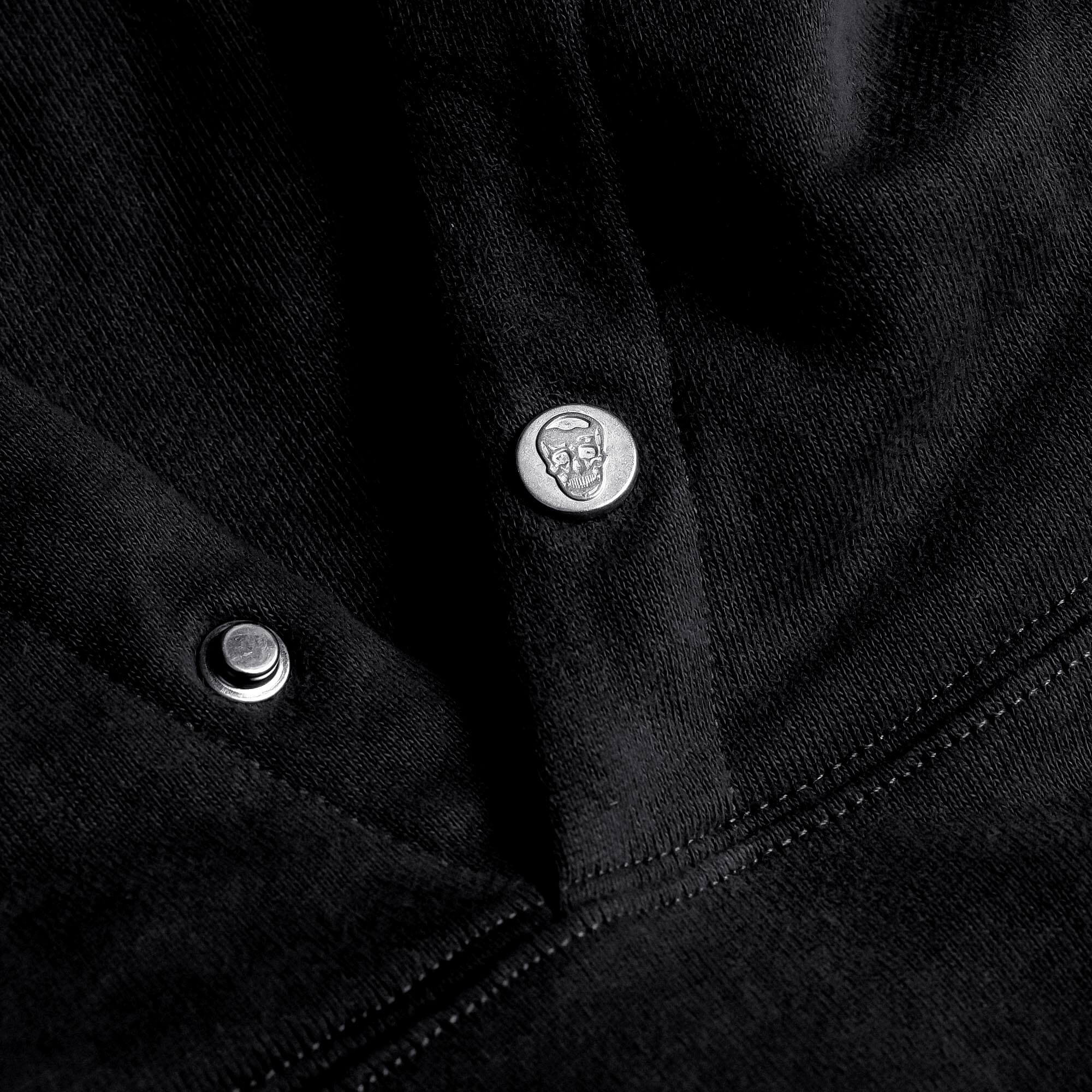Black Heavyweight Hoodie lay flat detail shot of branded buttons