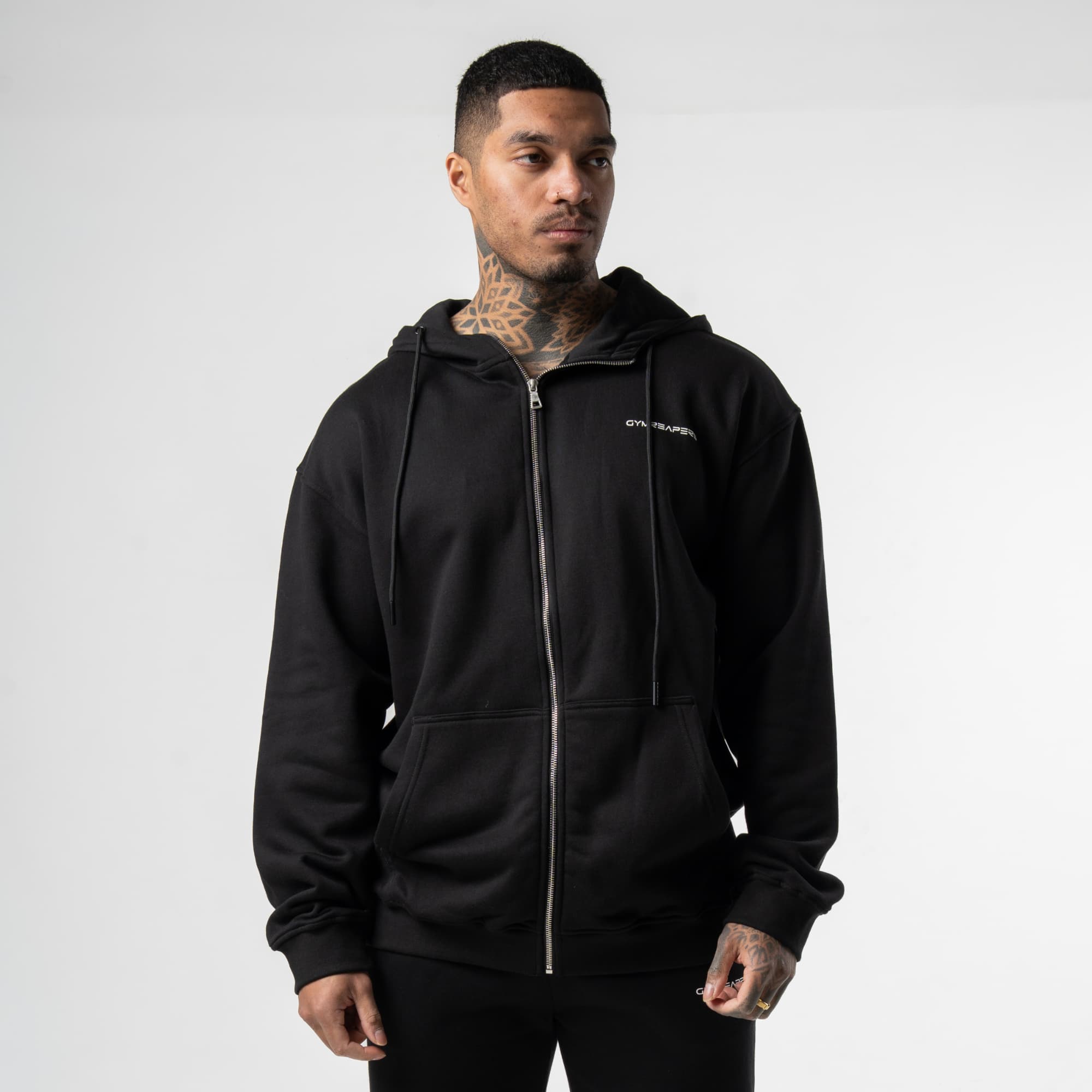 athlete wearing black/white axis zip up