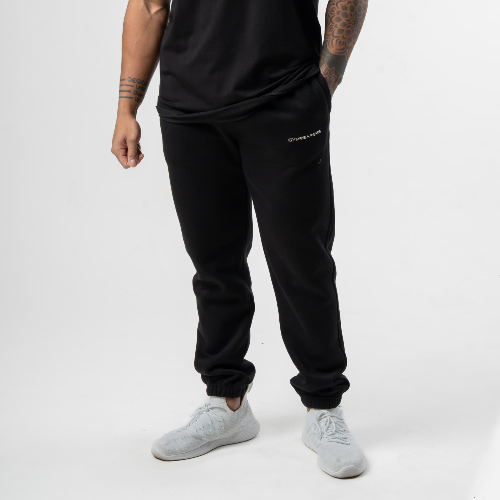 athlete wearing black/white axis joggers front view