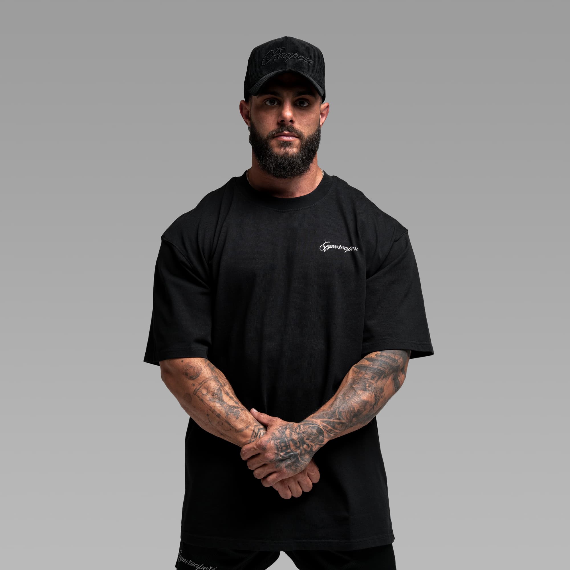 Athlete wearing the Midnight Reaper Tee half body shot front side