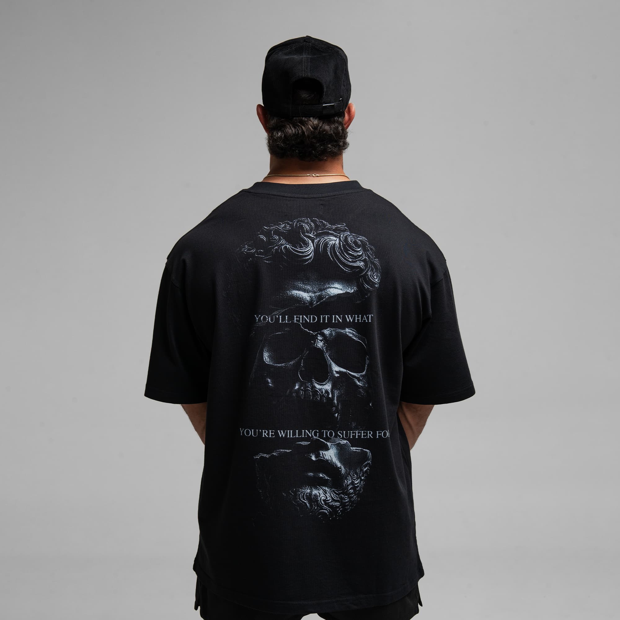 Athlete wearing Violent Faith Tee half body shot back view