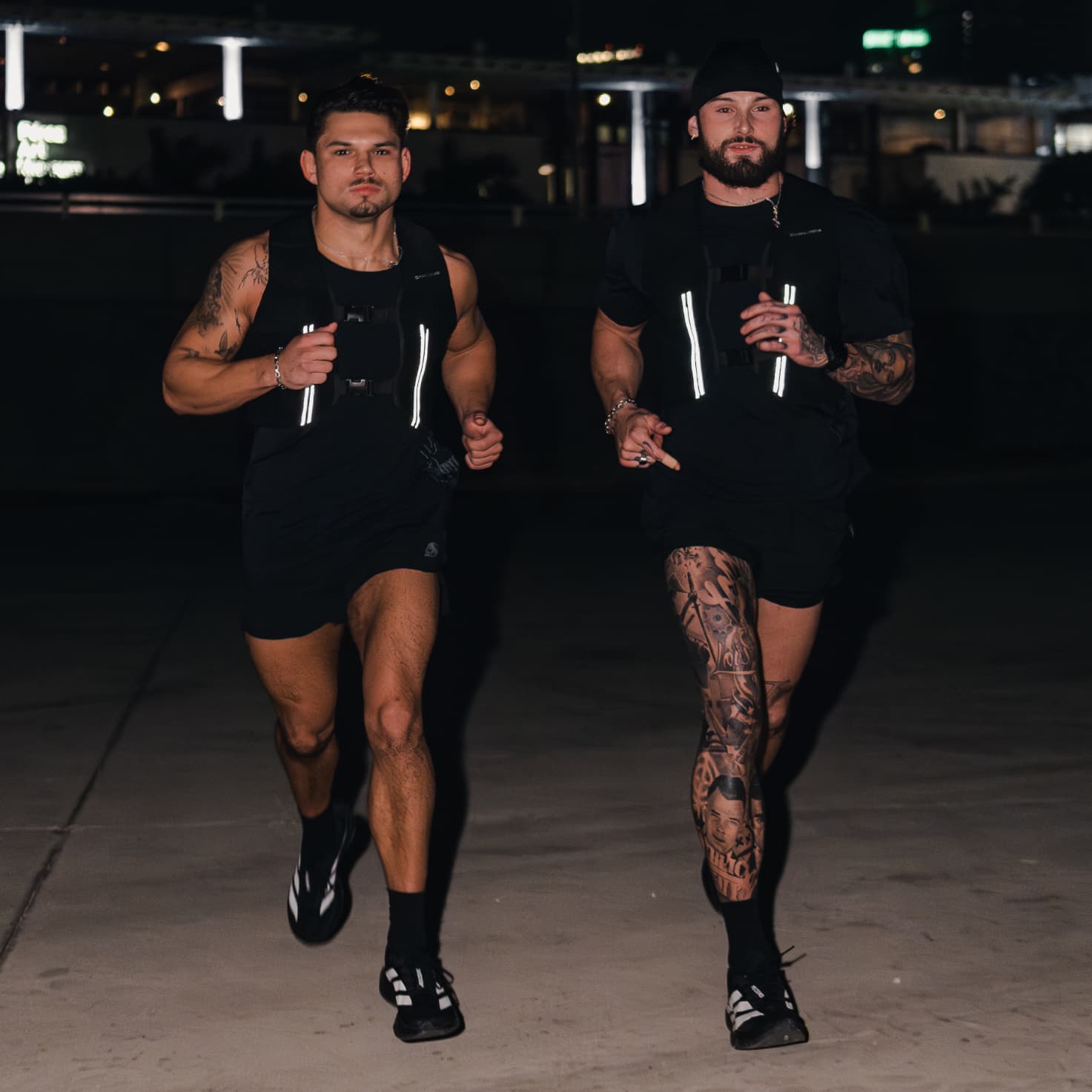 Lifestyle shot of athletes running towards the camera wearing the Ghost 5" Run Shorts
