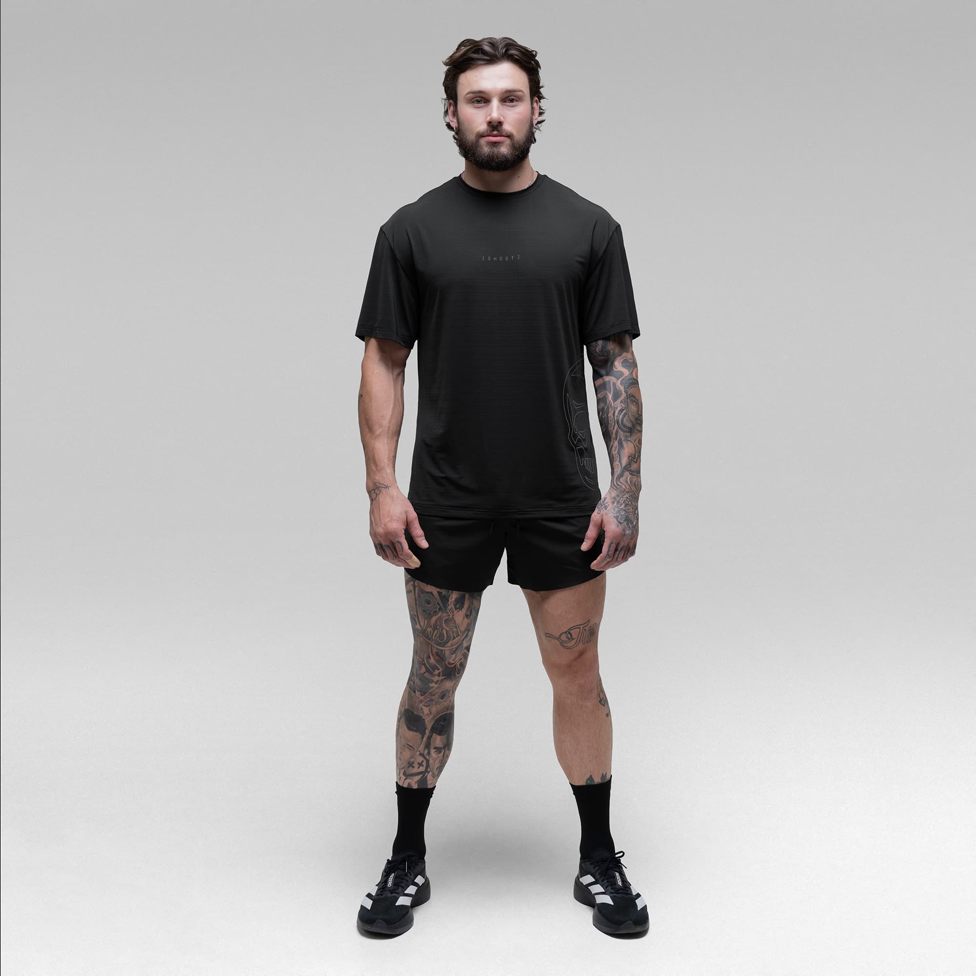 Athlete wearing the Ghost Oversized Tee full body shot front view