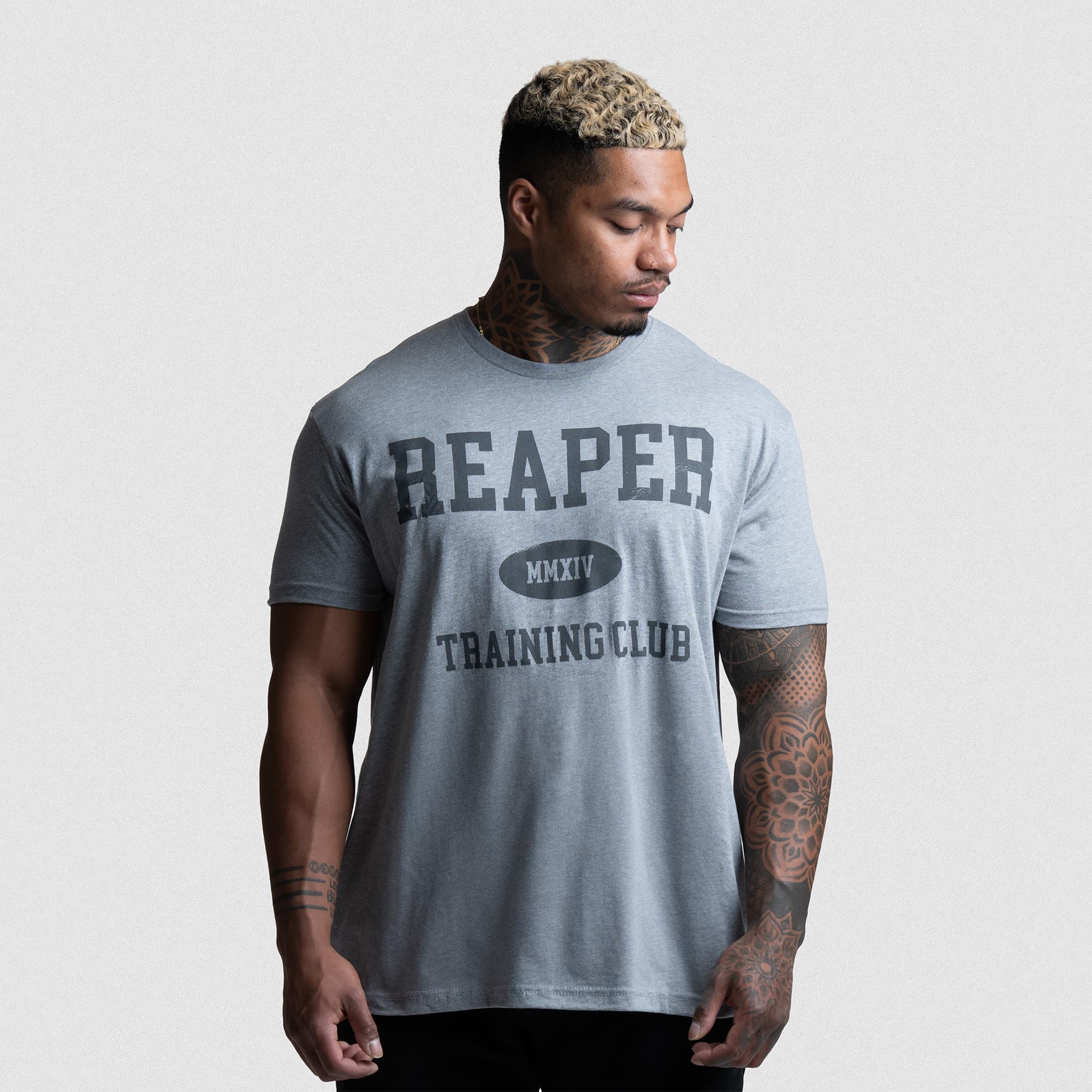 Athlete wearing the Reaper Training Club Tee in gray, front view with bold Reaper MMXIV graphic.