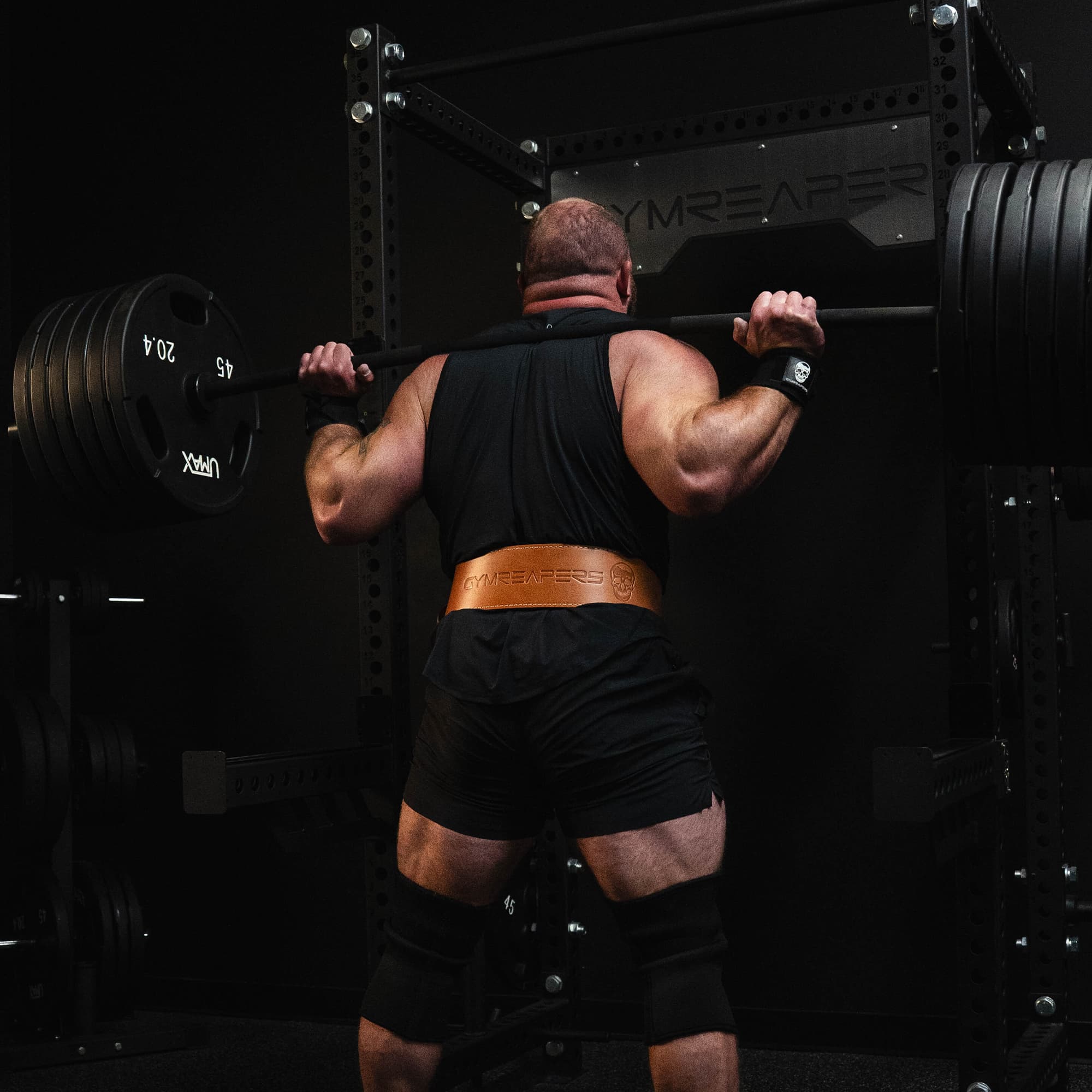 Shot of athlete squatting while wearing the heritage lever belt