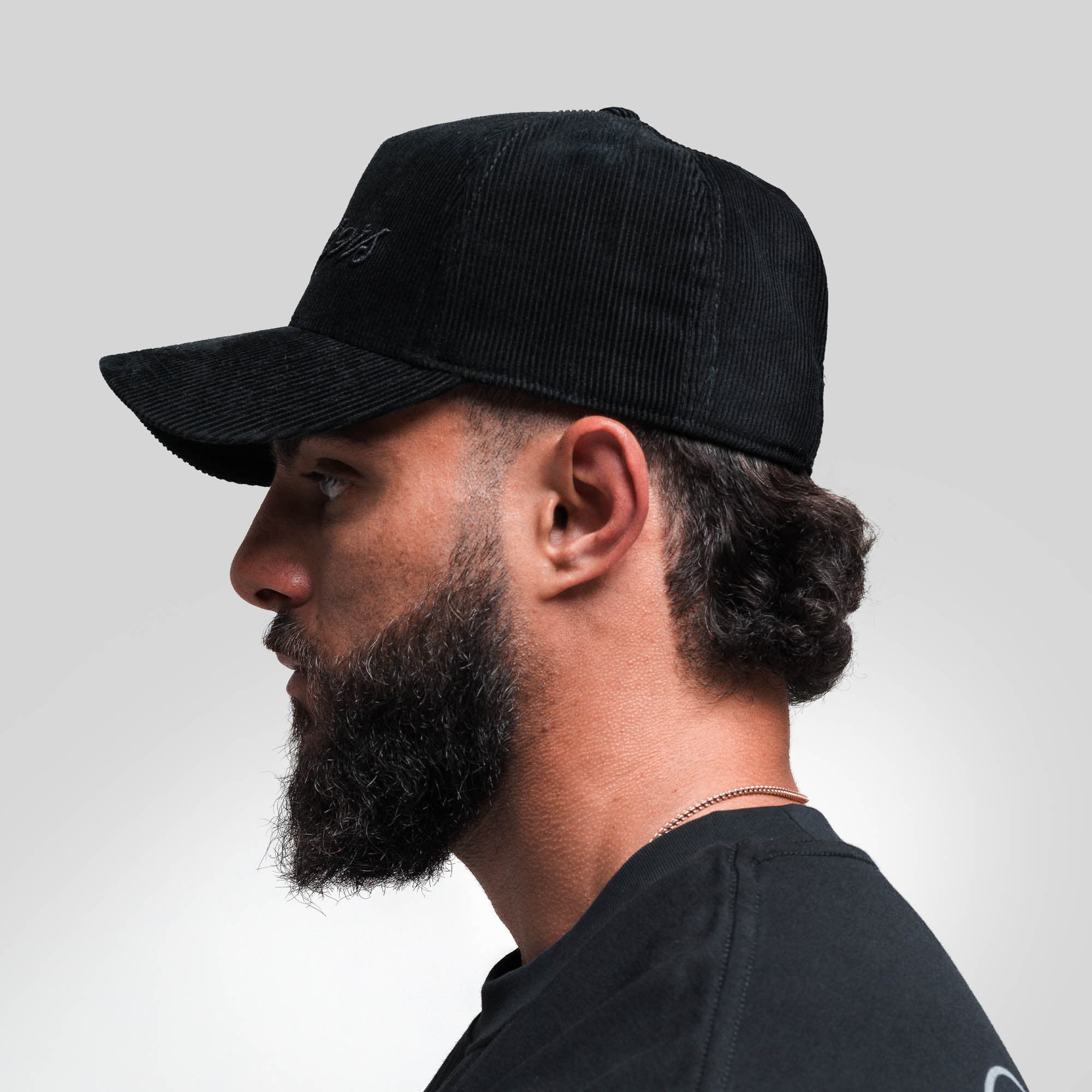 Athlete wearing Corduroy Reapers 5-Panel Hat - Black/Black side view