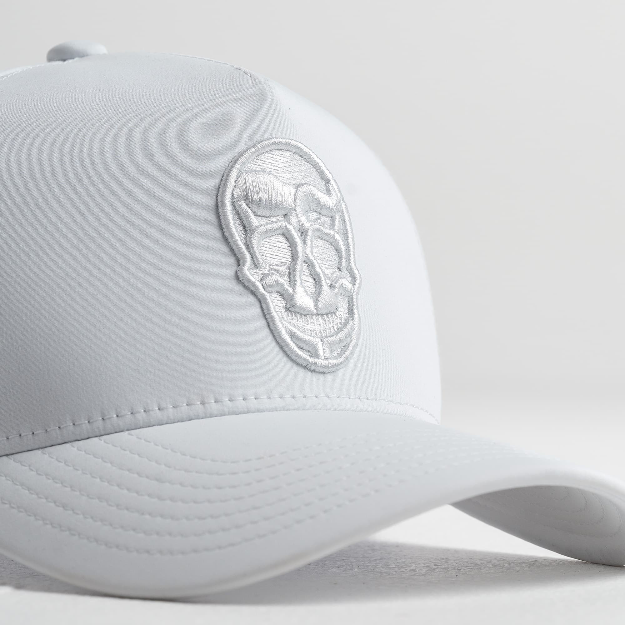 Hybrid Performance 5-Panel Hat - White/White close up shot of logo