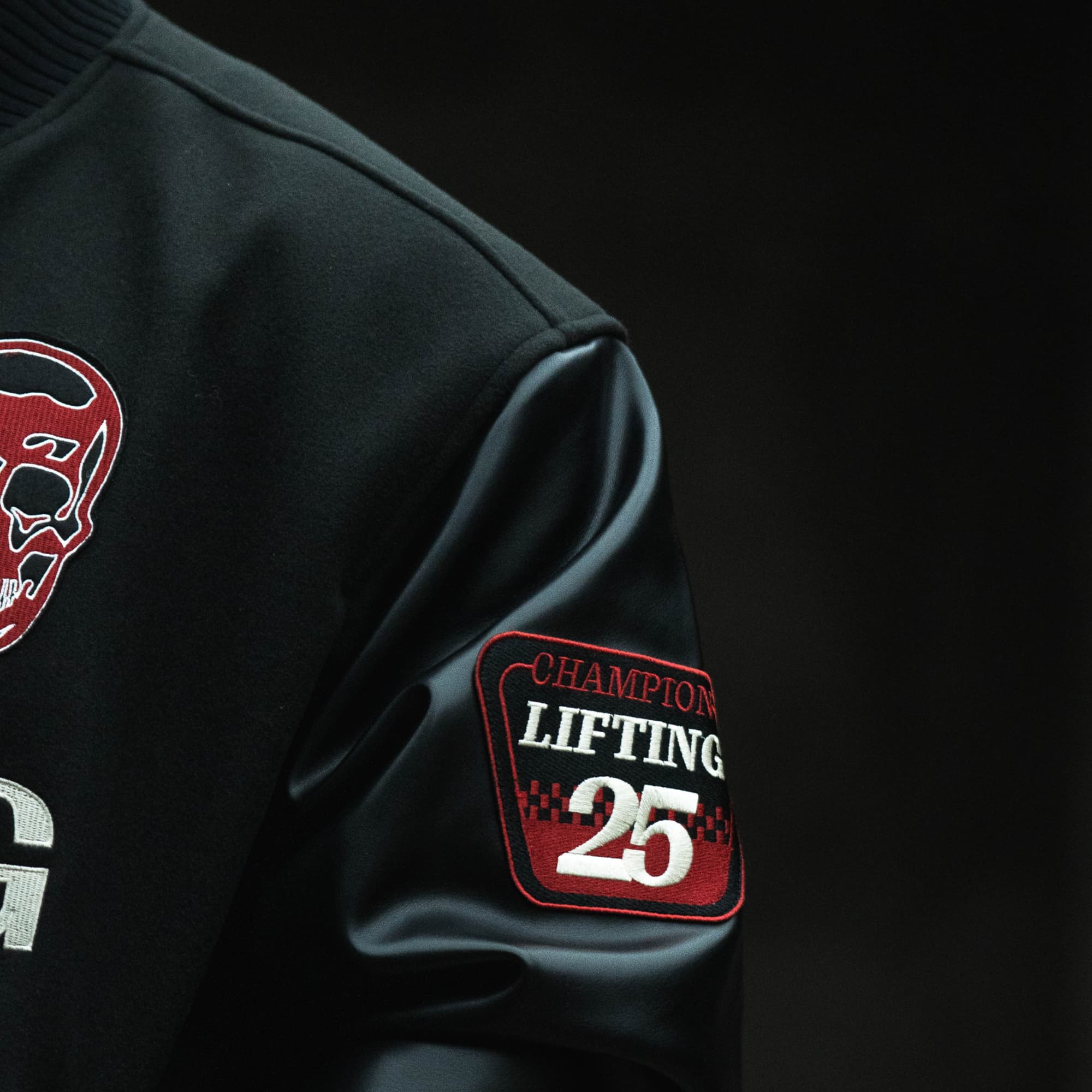 GRxO Racing Team Varsity Jacket on athlete close up detail shot of patch on sleeve