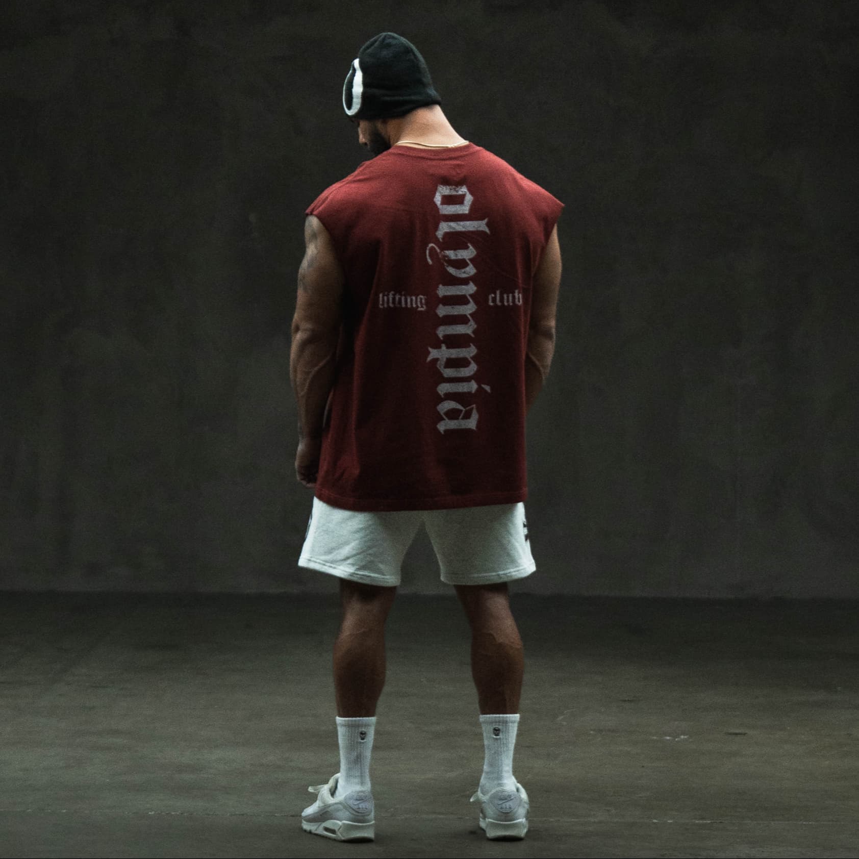 Athlete wearing the olympia cut off showing the olympia back graphic