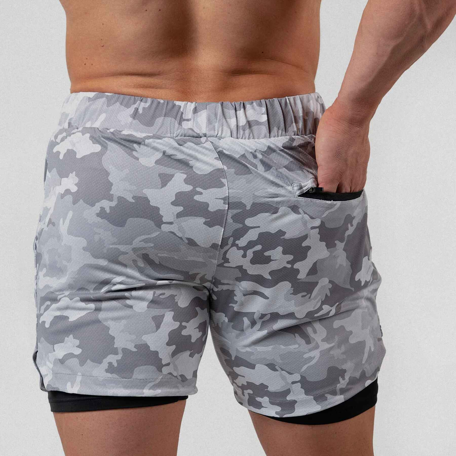 Gymreapers React training shorts white camo color way on athlete showcasing the back of the shorts.