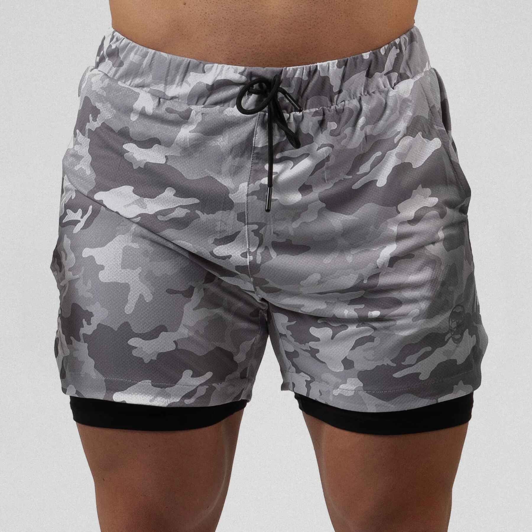 Gymreapers react training shorts white camo color way on athlete showcasing the front.