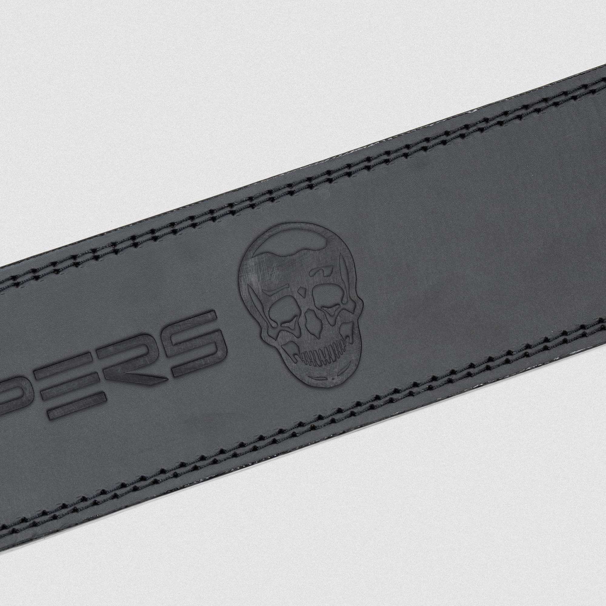 Close up detail shot of the Black Leather 10mm Lever Belt logo
