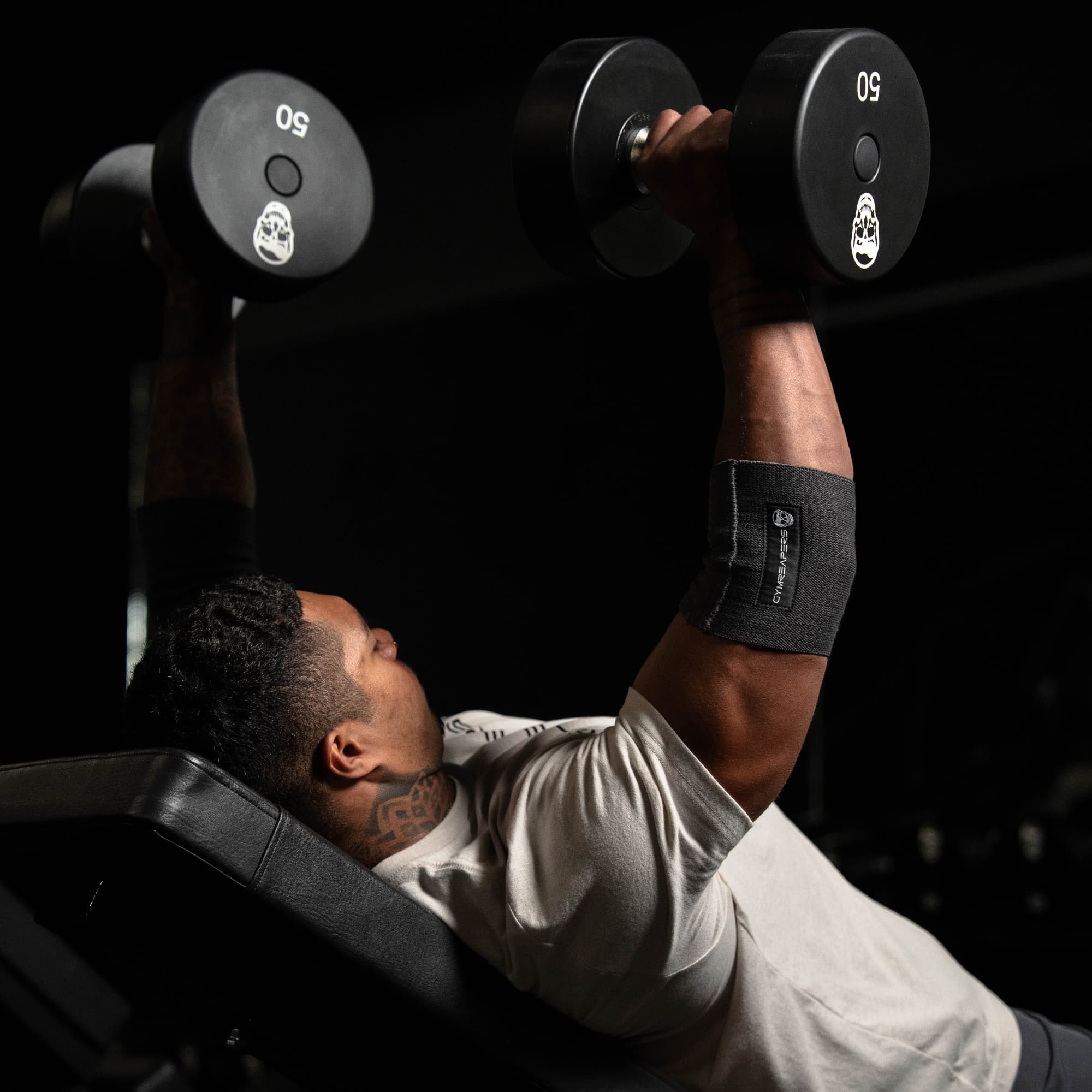 athlete training while wearing an elbow compression cuff