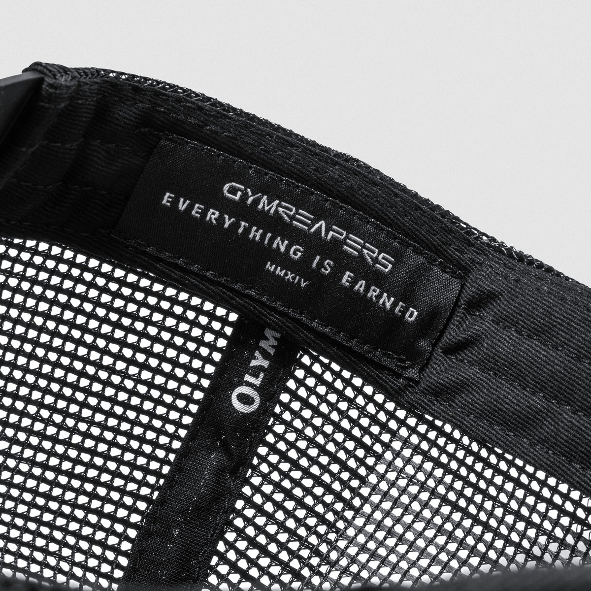 Inside tag of the Signature 5-Panel Trucker Hat with GYMREAPERS Everything Earned MMXIV text