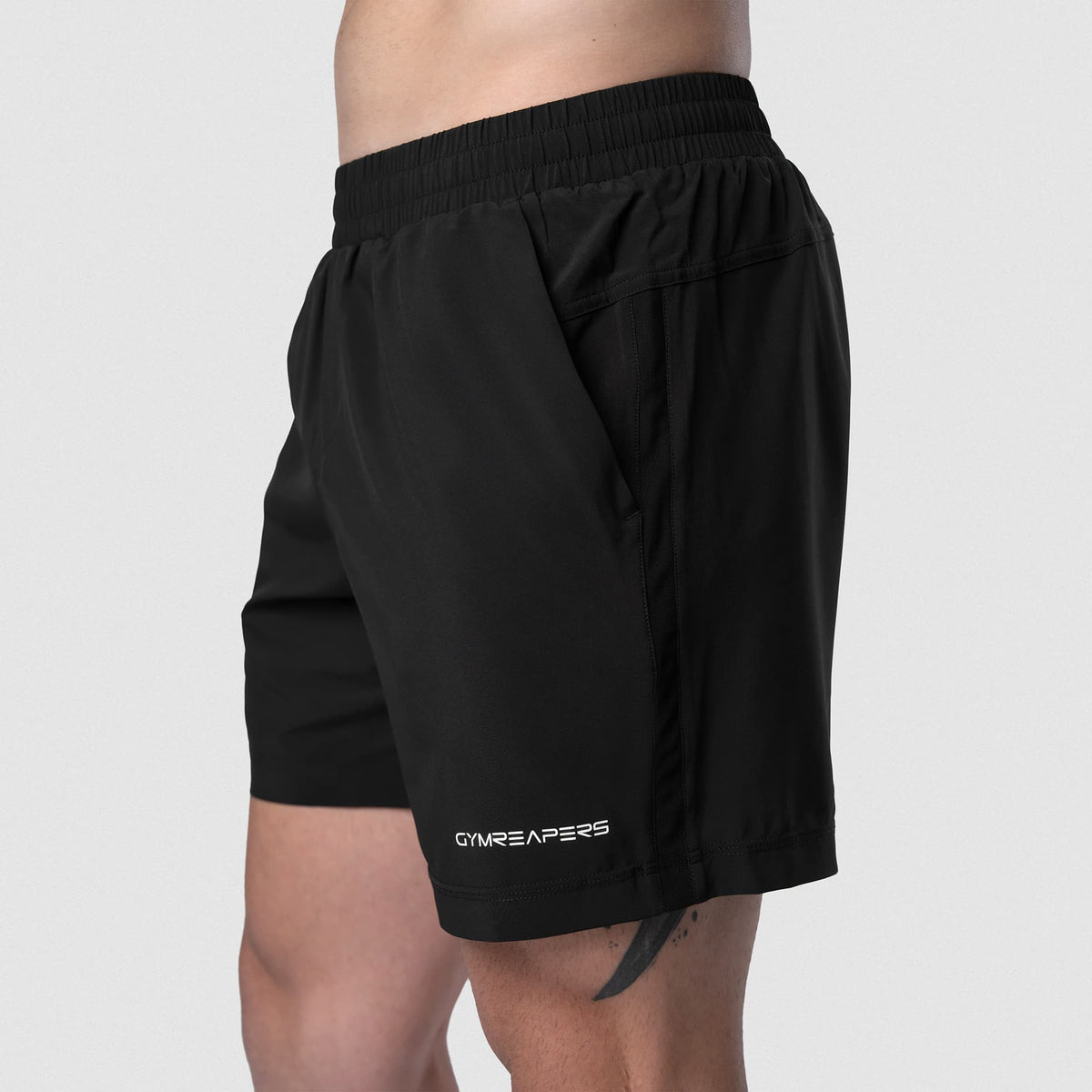 Male model wearing the Axis 6" Lined Shorts - Black/White side view