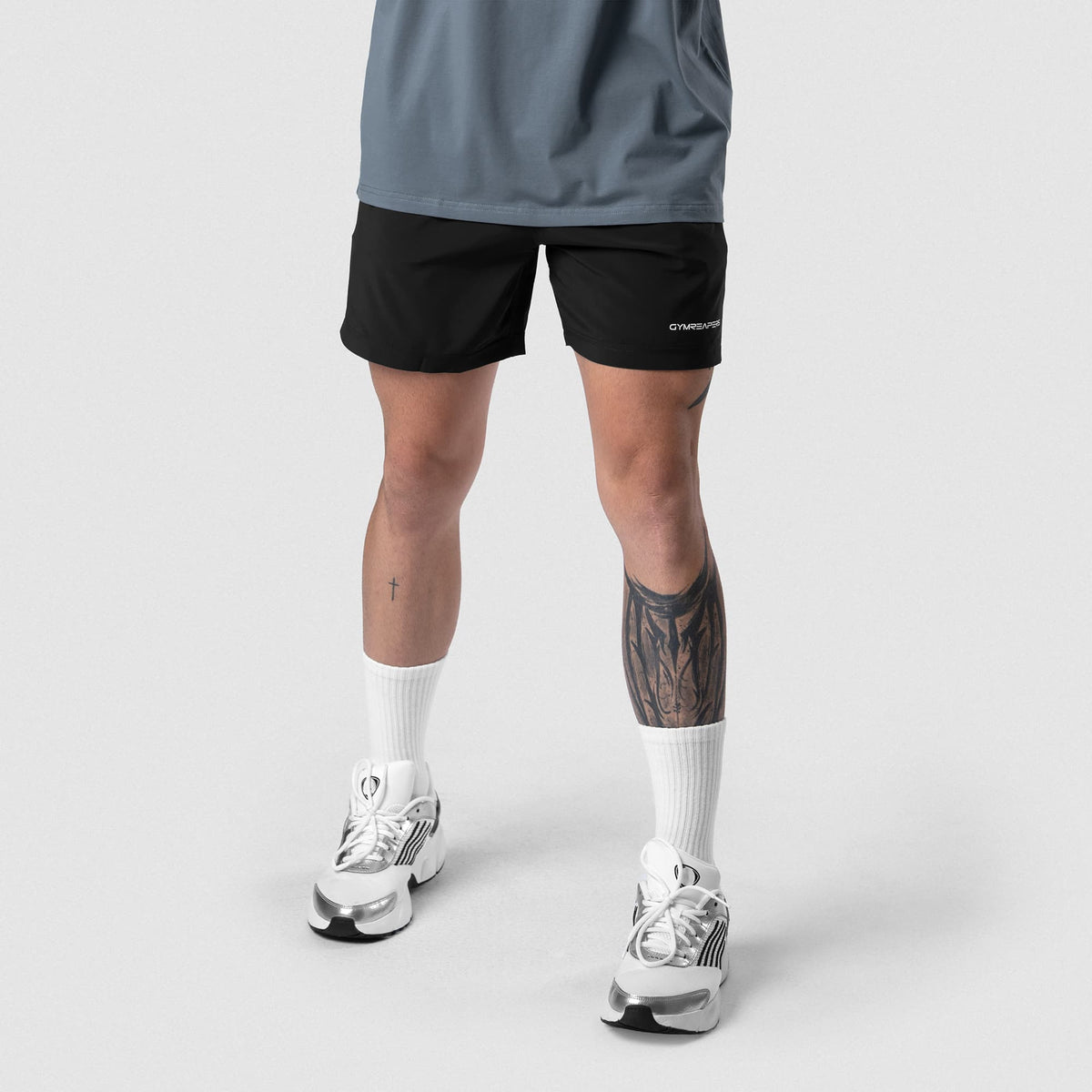 Male model wearing the Axis 6" Lined Shorts - Black/White front view