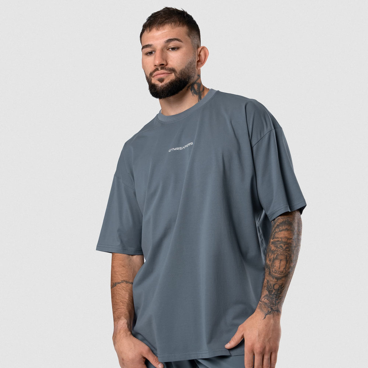 Male model wearing the Axis Box Tee - Lake front view