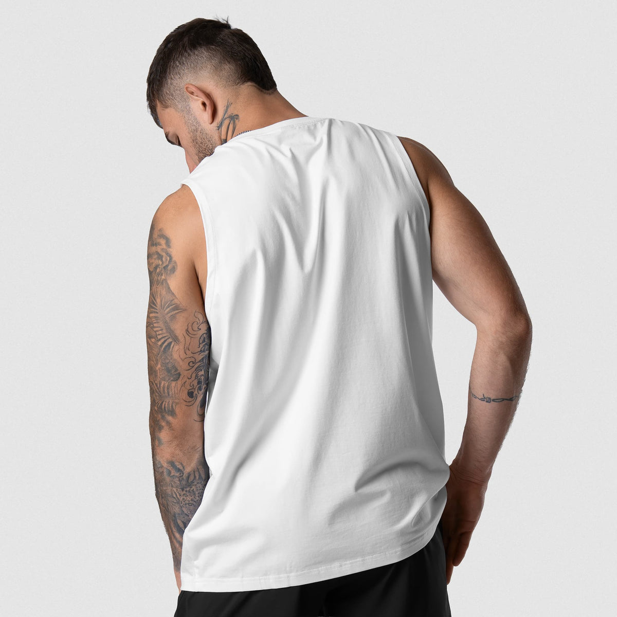 Man wearing Axis Muscle Tank - White back fit