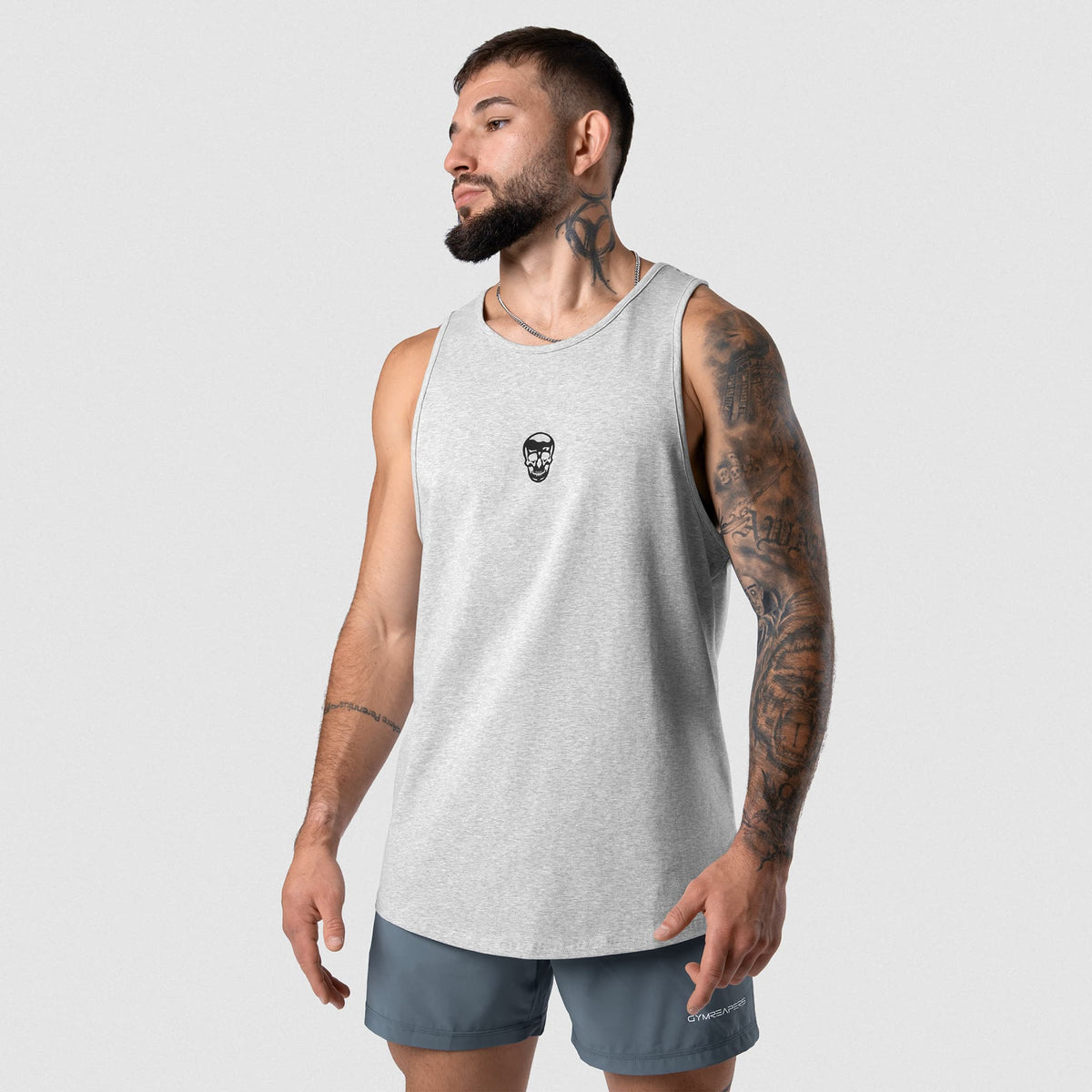 Male model wearing the Axis Scoop Hem Tank - Heather Gray front view