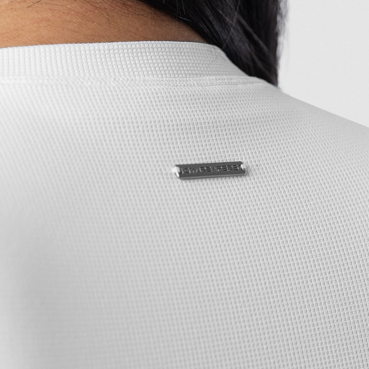 Axis Support Baby Tee - White back neckline and logo detail