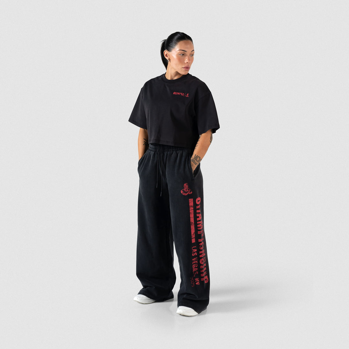 Full body view of female model wearing the Championship Crop Tee paired with matching sweatpants