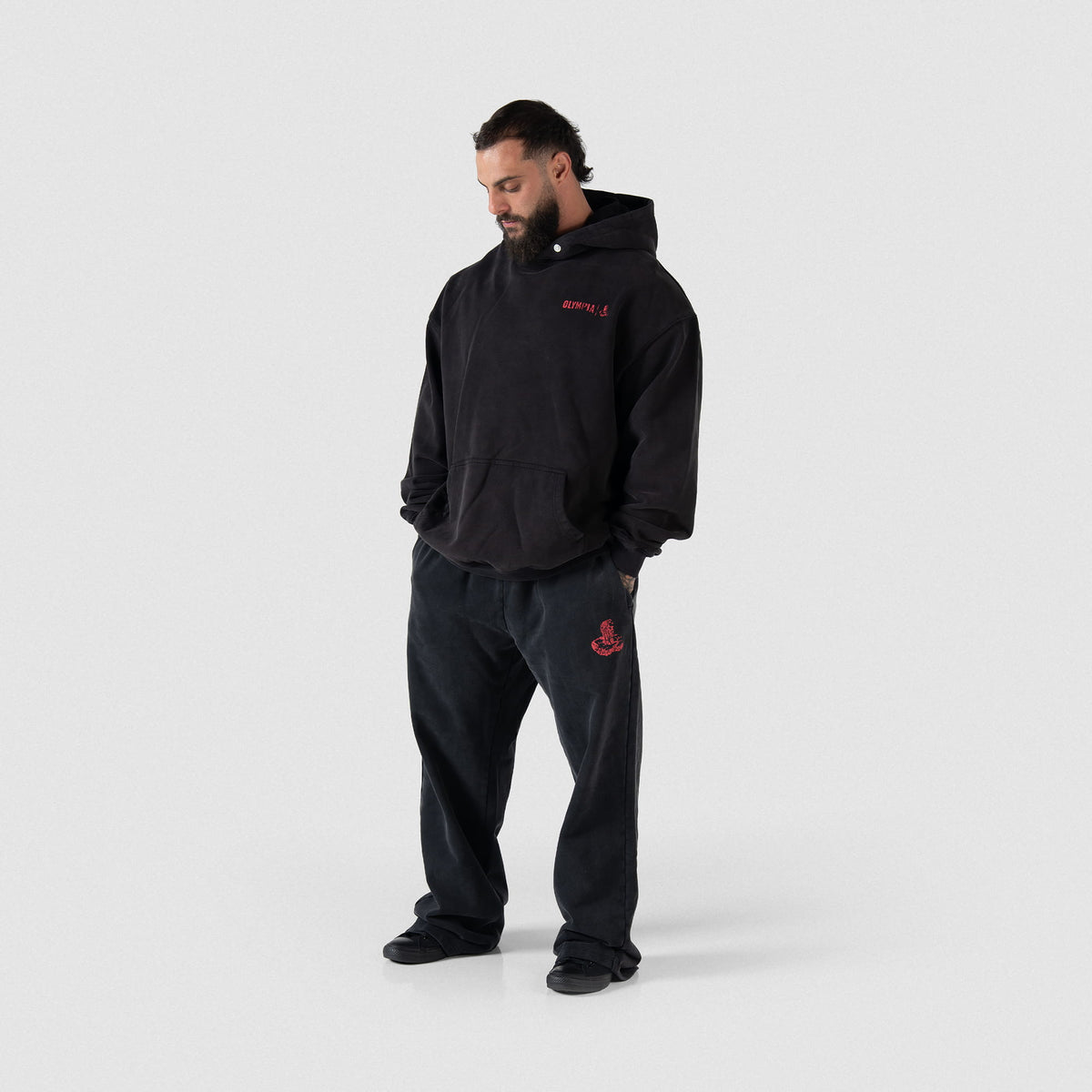 Championship Hoodie | Full body front view of male model wearing the black hoodie and matching joggers