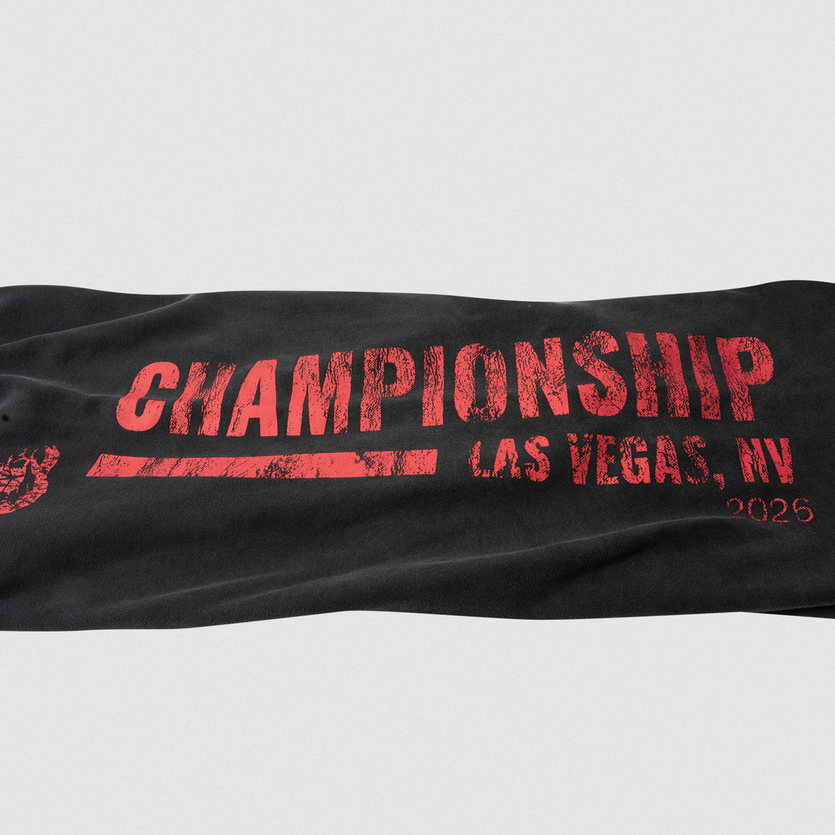 Close up of the large "CHAMPIONSHOP LAS VEGAS, NV 2026" wordmark logo that runs down the pant leg of the Championship Wide-Leg Jogger