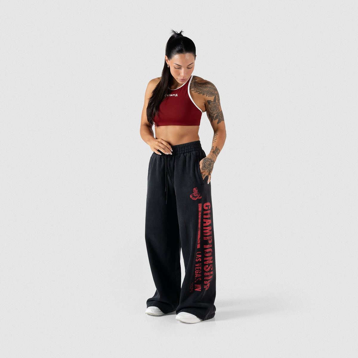 Contrasting Red and white high neck olympia bra paired with black wide leg joggers