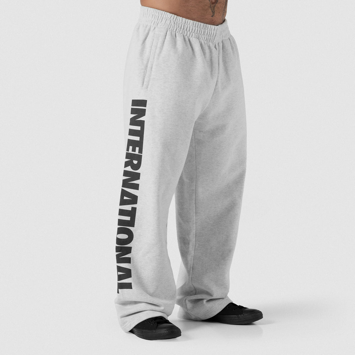 Male model wearing the Olympia International Division Straight-Leg Jogger in gray, showing the 