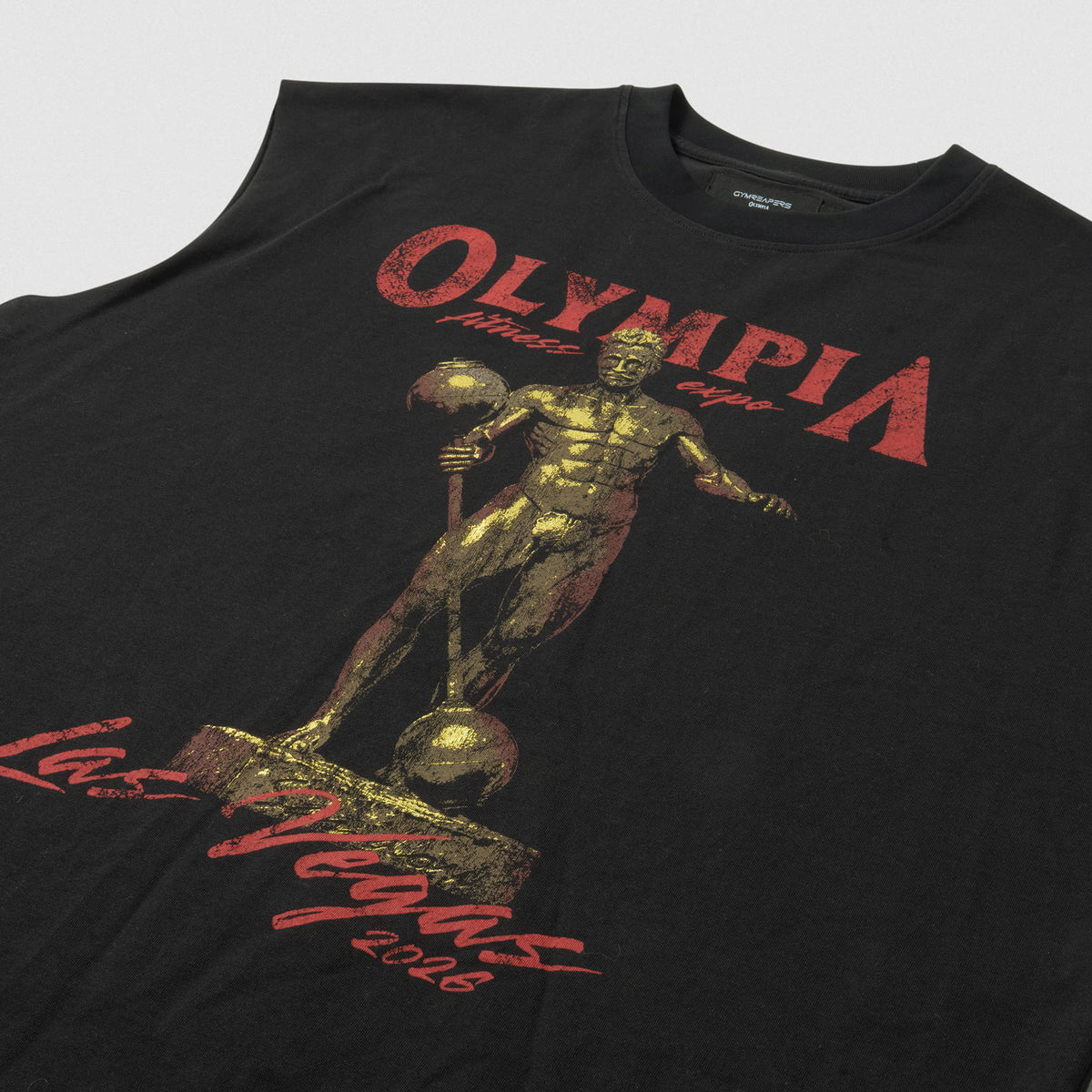Full view of front graphic on the Olympia 2026 Sandow Cut-Off with gold Olympia status and surrounding text that says "Olympia fitness expo Last Vegas 2026"
