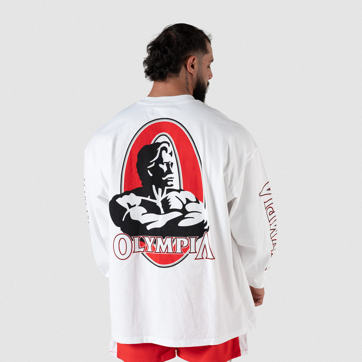 Back torso view of male model wearing the Signature Long Sleeve Tee in White