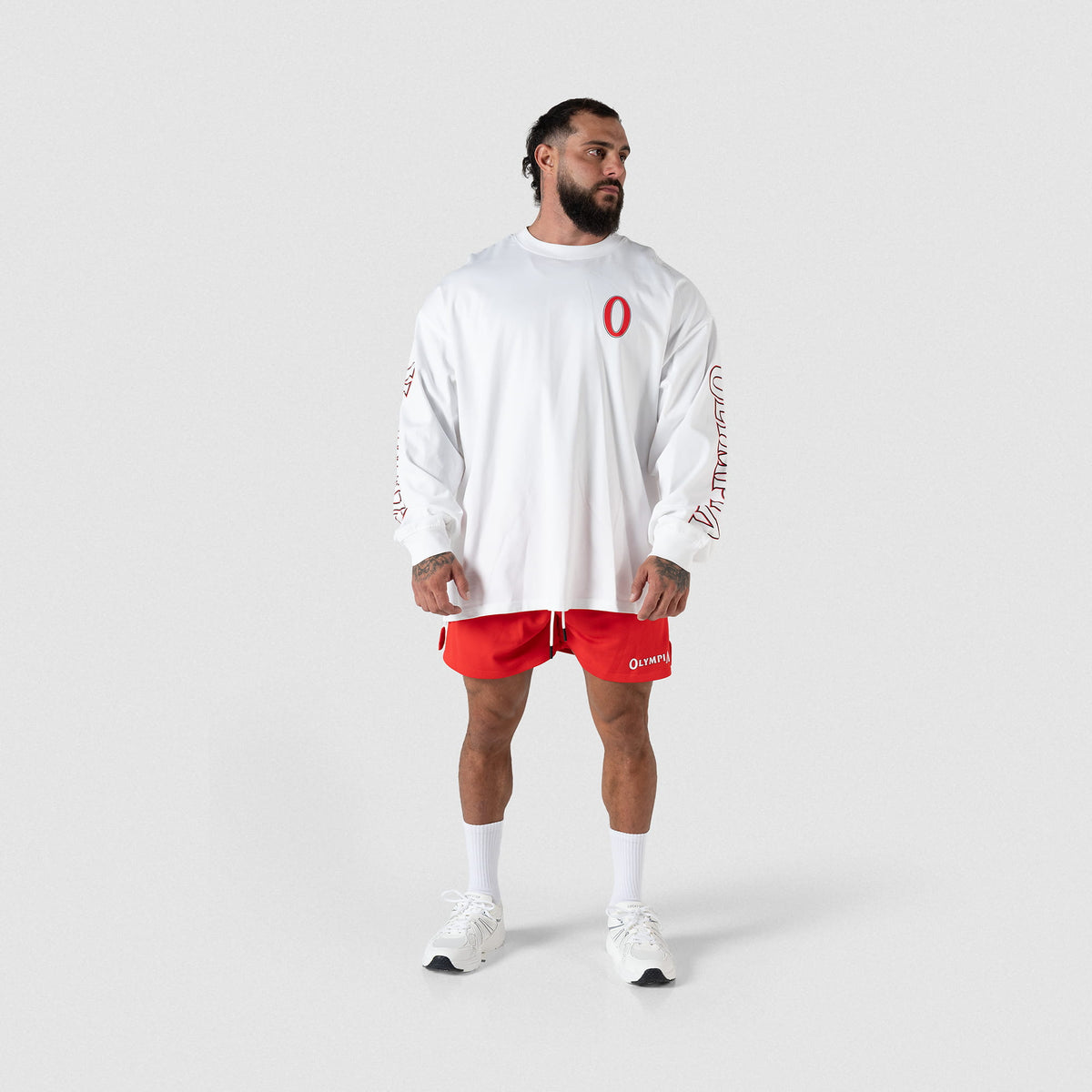 Full body male model view of the Signature Long Sleeve in White to show fit and length
