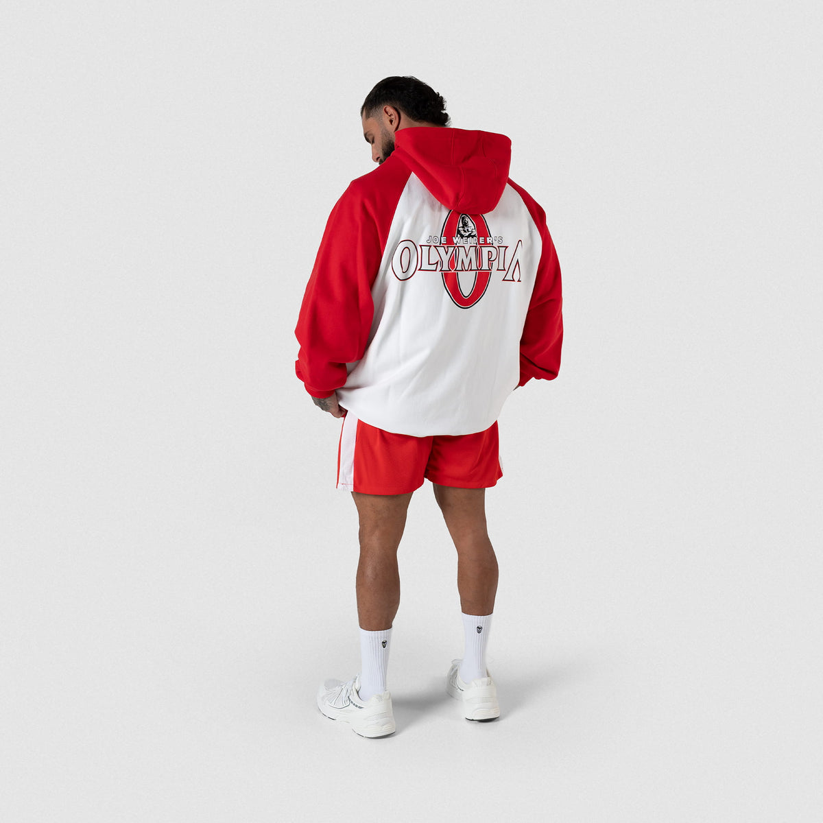 Signature Zip-Up Hoodie | Male model full body pose back view of large back graphic and matching shorts