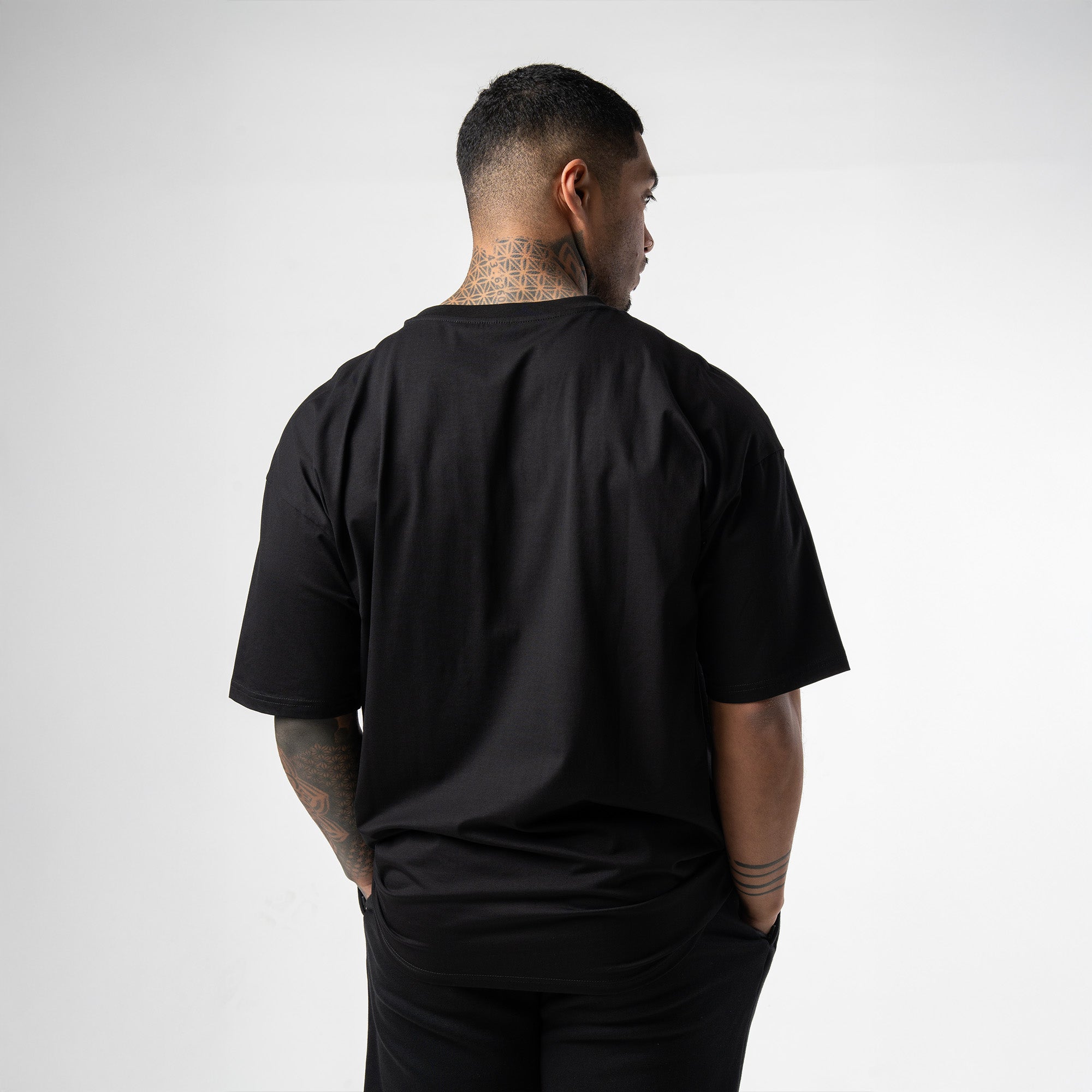 athlete wearing black/white axis box tee back view