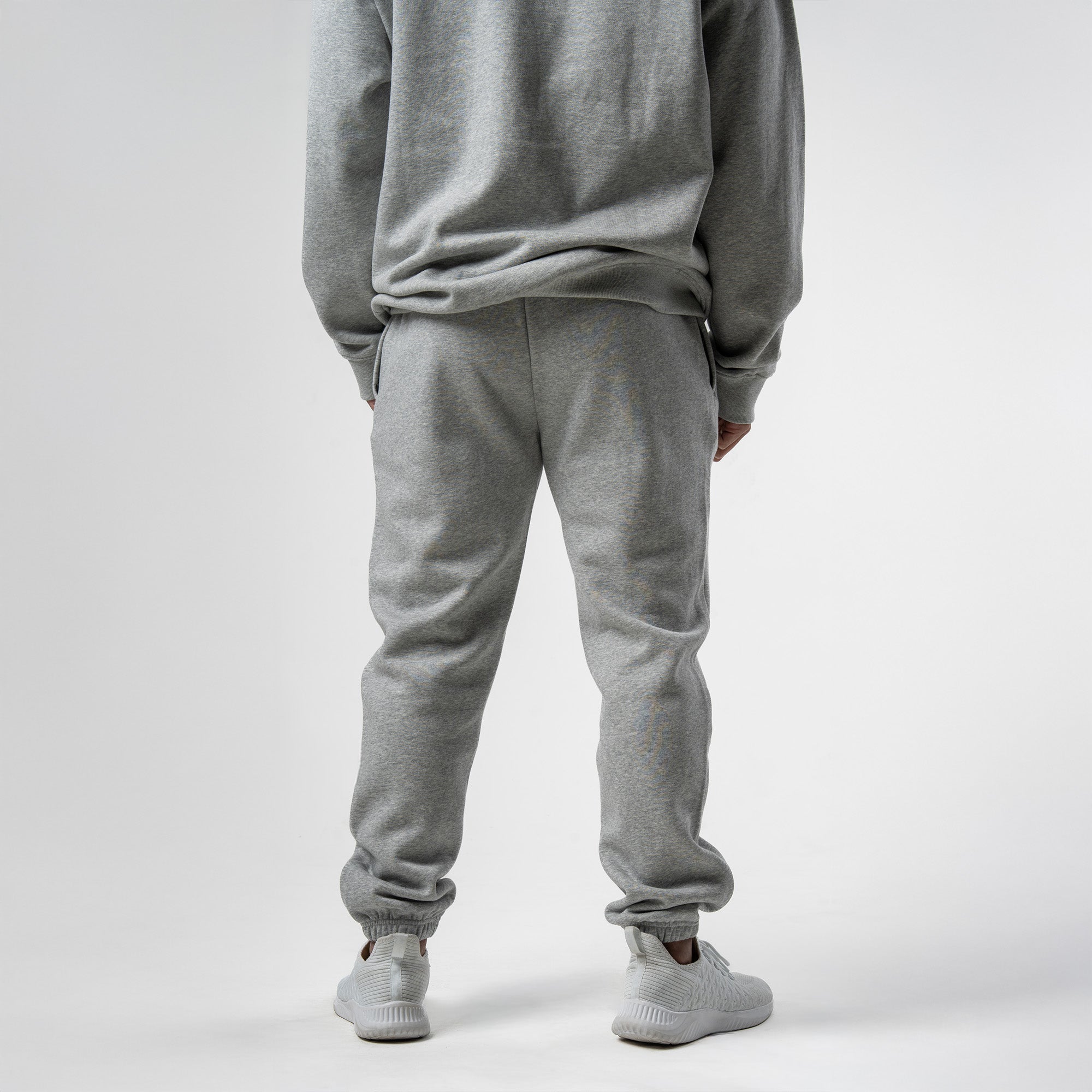 athlete wearing gray axis joggers back view