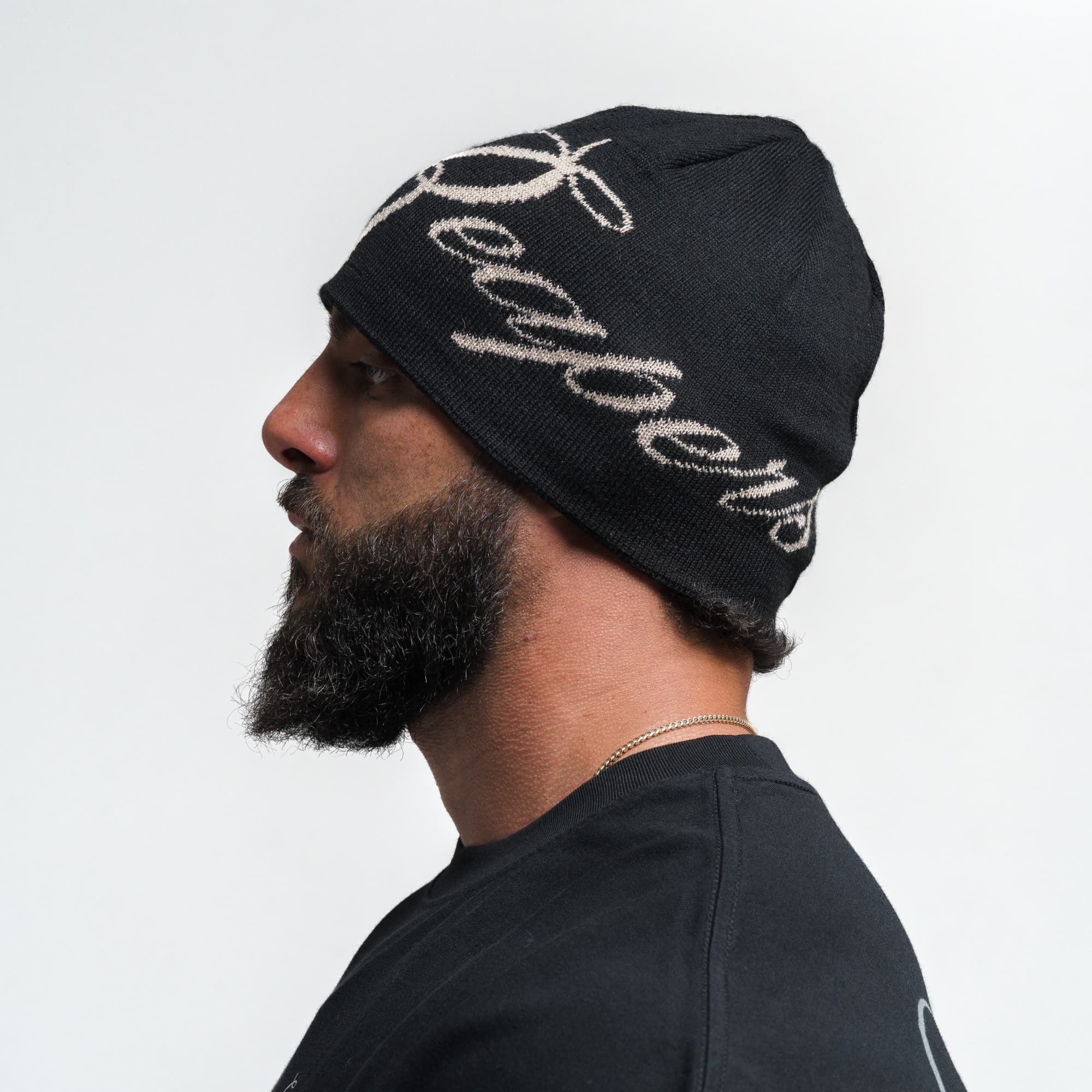 Athlete wearing Reapers Skull Cap Beanie - Black/Tan side view
