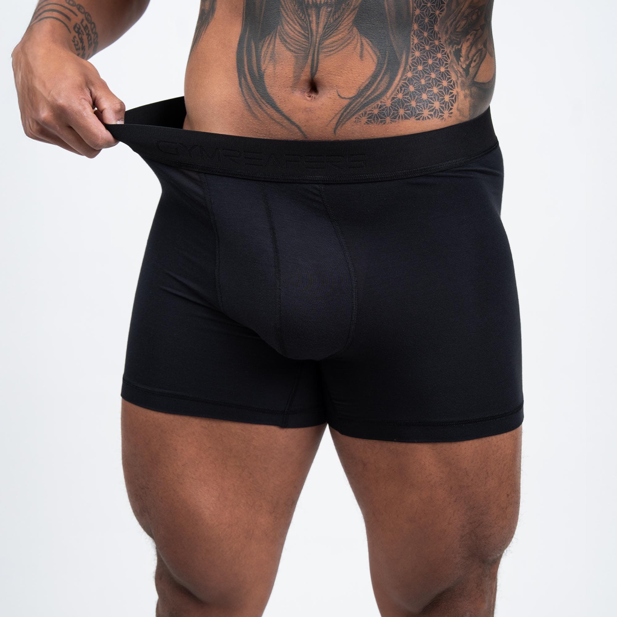 Athlete wearing the Black Everyday Boxer Briefs showcasing the stretch in the waistband