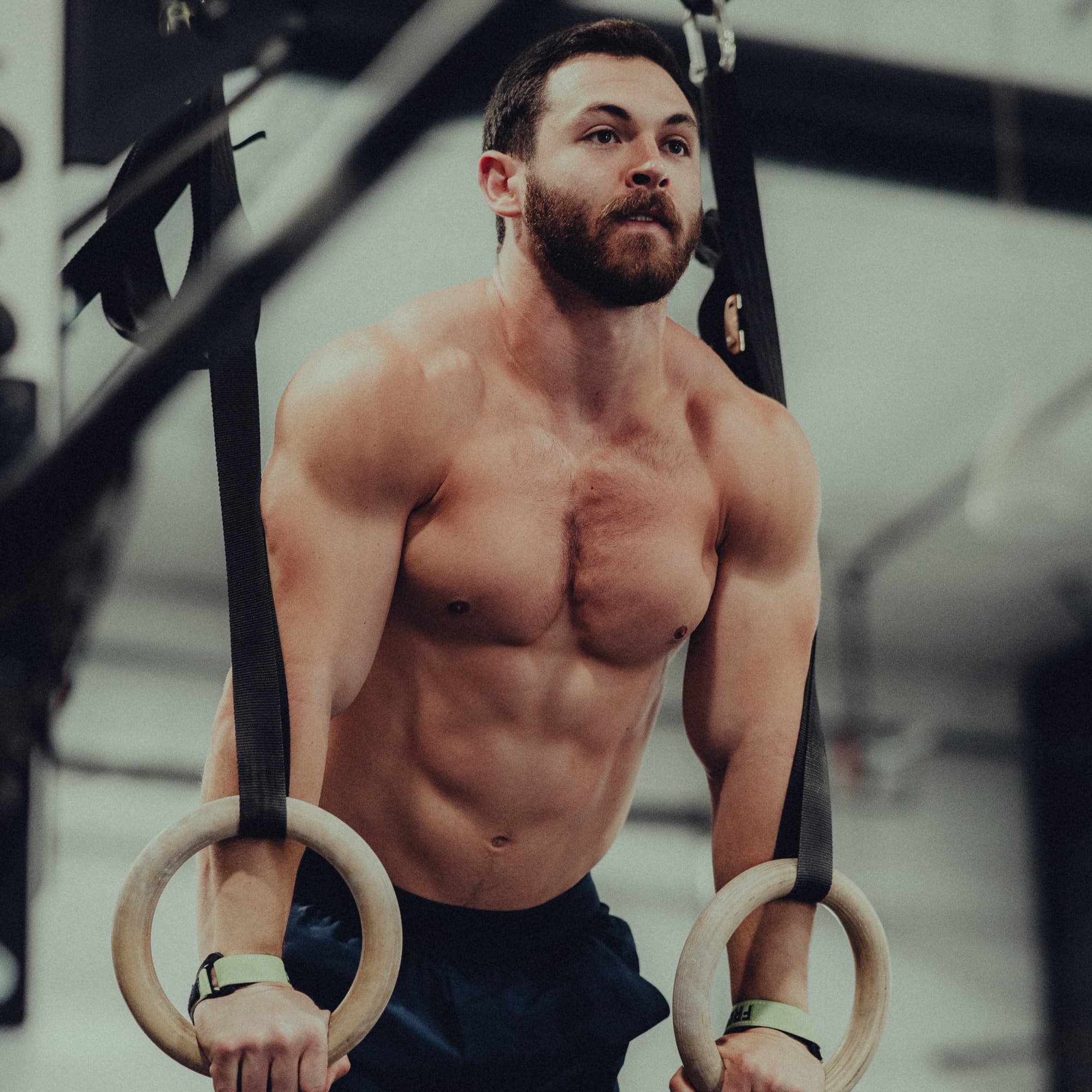 Austin Hatfield performing a ring hold during a CrossFit workout.